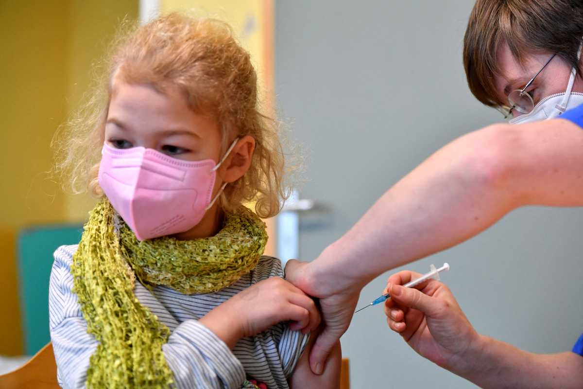 Juno, 7-years old, is vaccinated against the coronavirus disease (COVID-19) in a Children's Vaccination Center in Leipzig, Germany, December 10, 2021. REUTERS