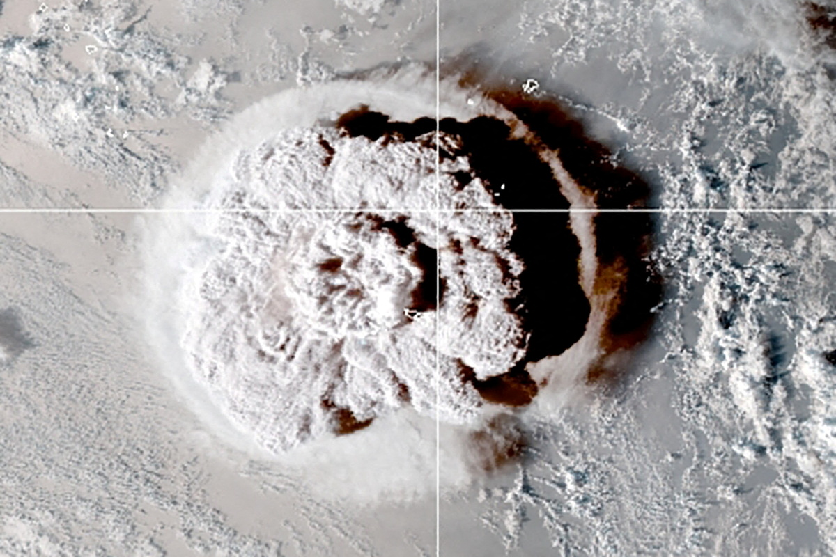The eruption of an underwater volcano off Tonga, which triggered a tsunami warning for several South Pacific island nations, is seen in an image from the NOAA GOES-West satellite taken at 05:00 GMT January 15, 2022. CIRA