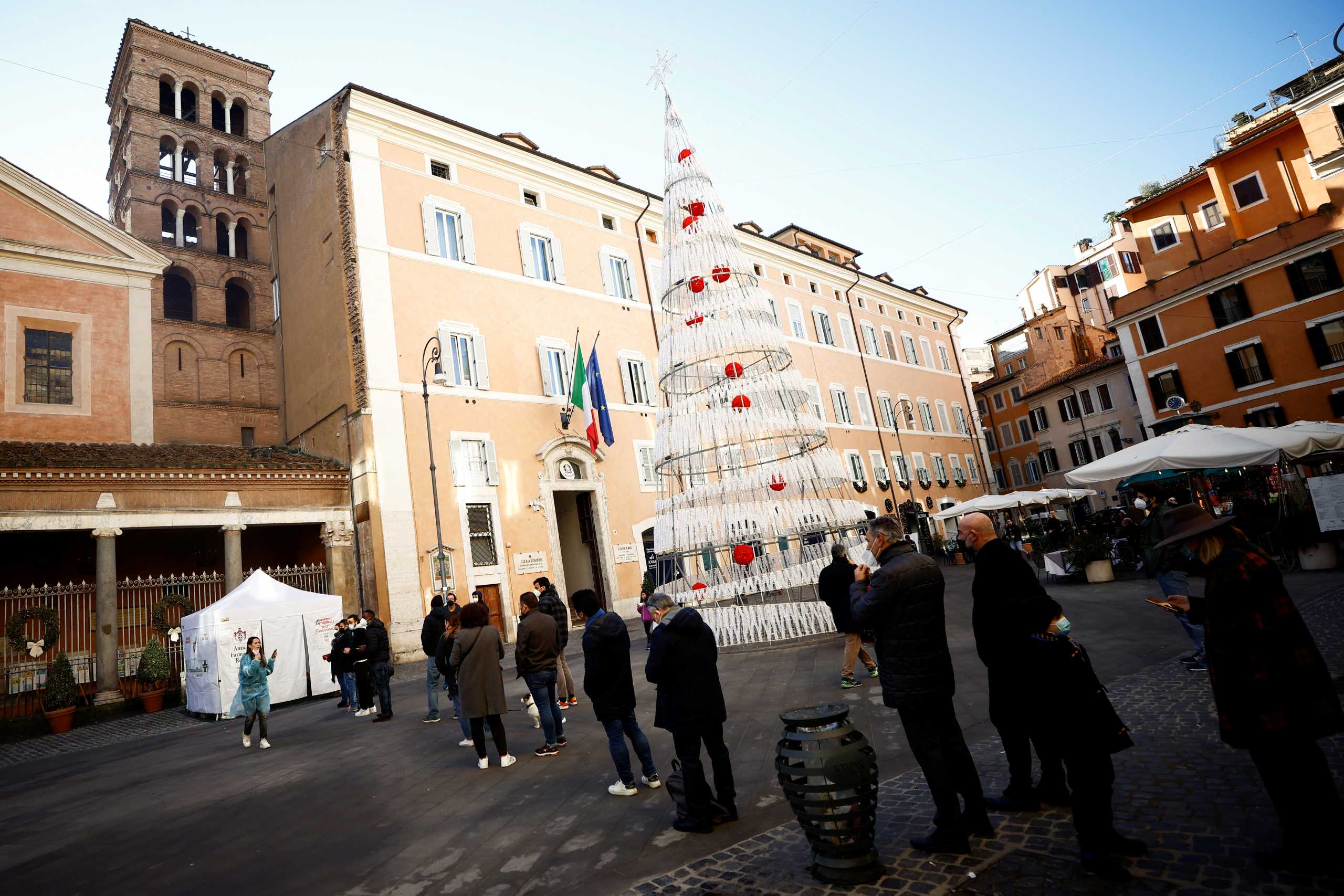 People queue to take a coronavirus disease (COVID-19) test at a pharmacy as COVID-19 infections rise in Rome, Italy, December 31, 2021. REUTERS