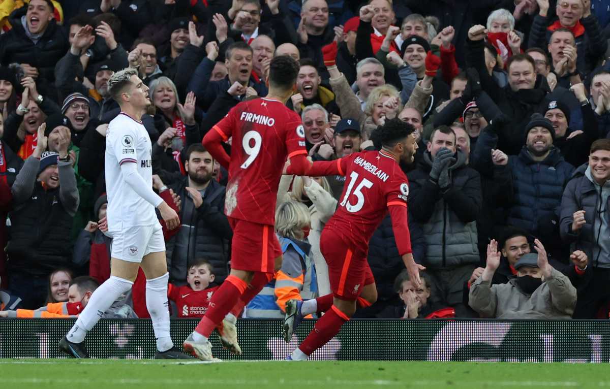 Soccer Football - Premier League - Liverpool v Brentford - Anfield, Liverpool, Britain - January 16, 2022 Liverpool's Alex Oxlade-Chamberlain celebrates scoring their second goal with Roberto Firmino as Brentford's Sergi Canos looks dejected REUTERS