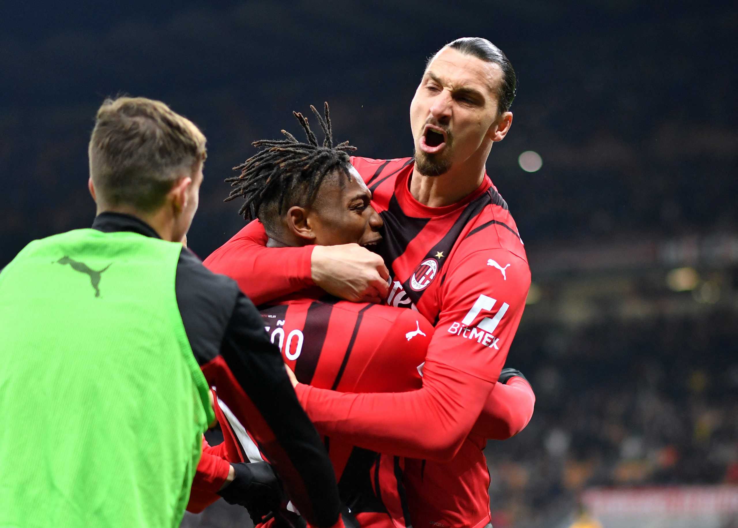 Soccer Football - Serie A - AC Milan v AS Roma - San Siro, Milan, Italy - January 6, 2022 AC Milan's Rafael Leao celebrates scoring their third goal with Zlatan Ibrahimovic REUTERS