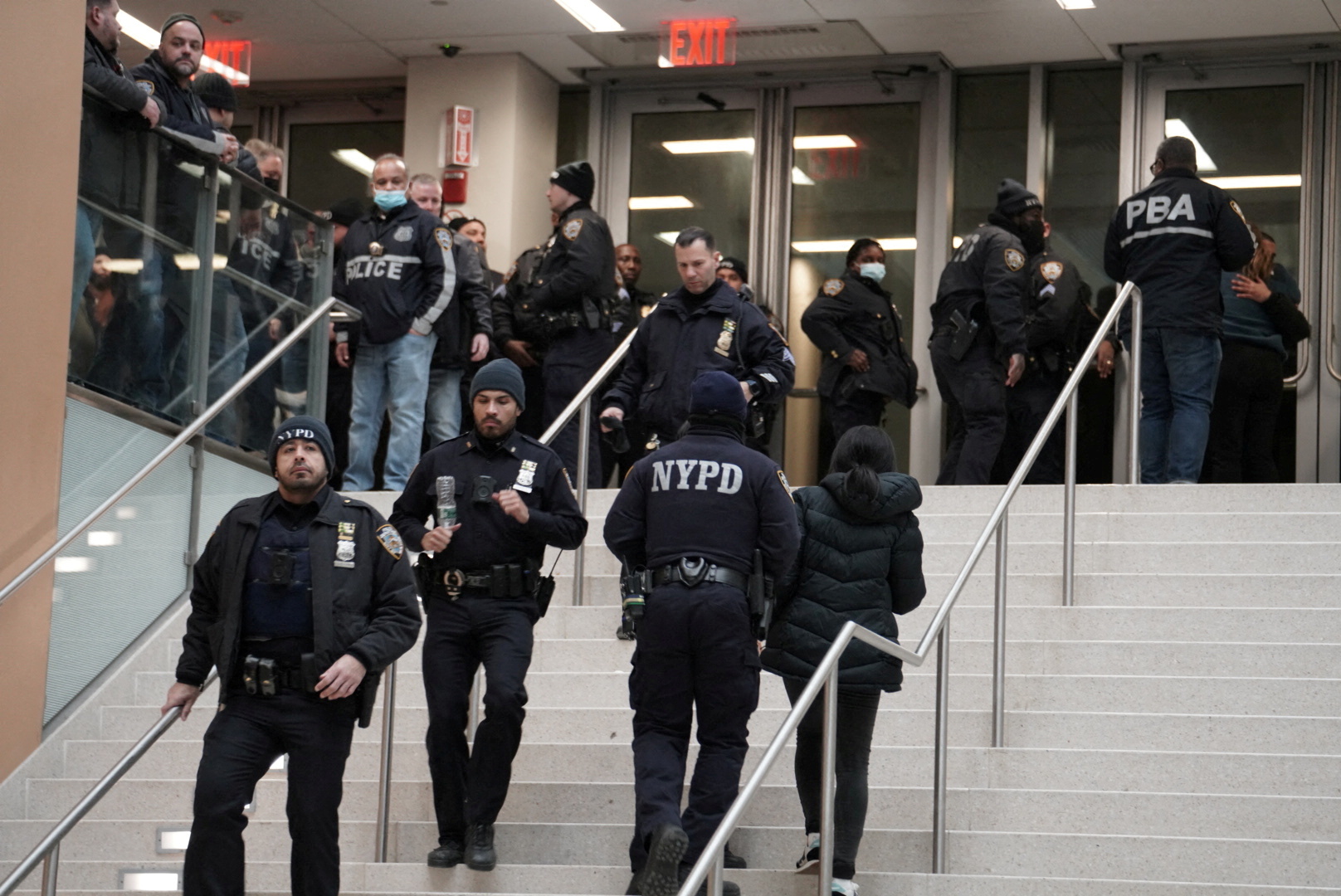 Police gather at a hospital near where NYPD officers were shot while responding to a domestic violence call in the Harlem neighborhood of New York City, U.S., January 21, 2022.   REUTERS