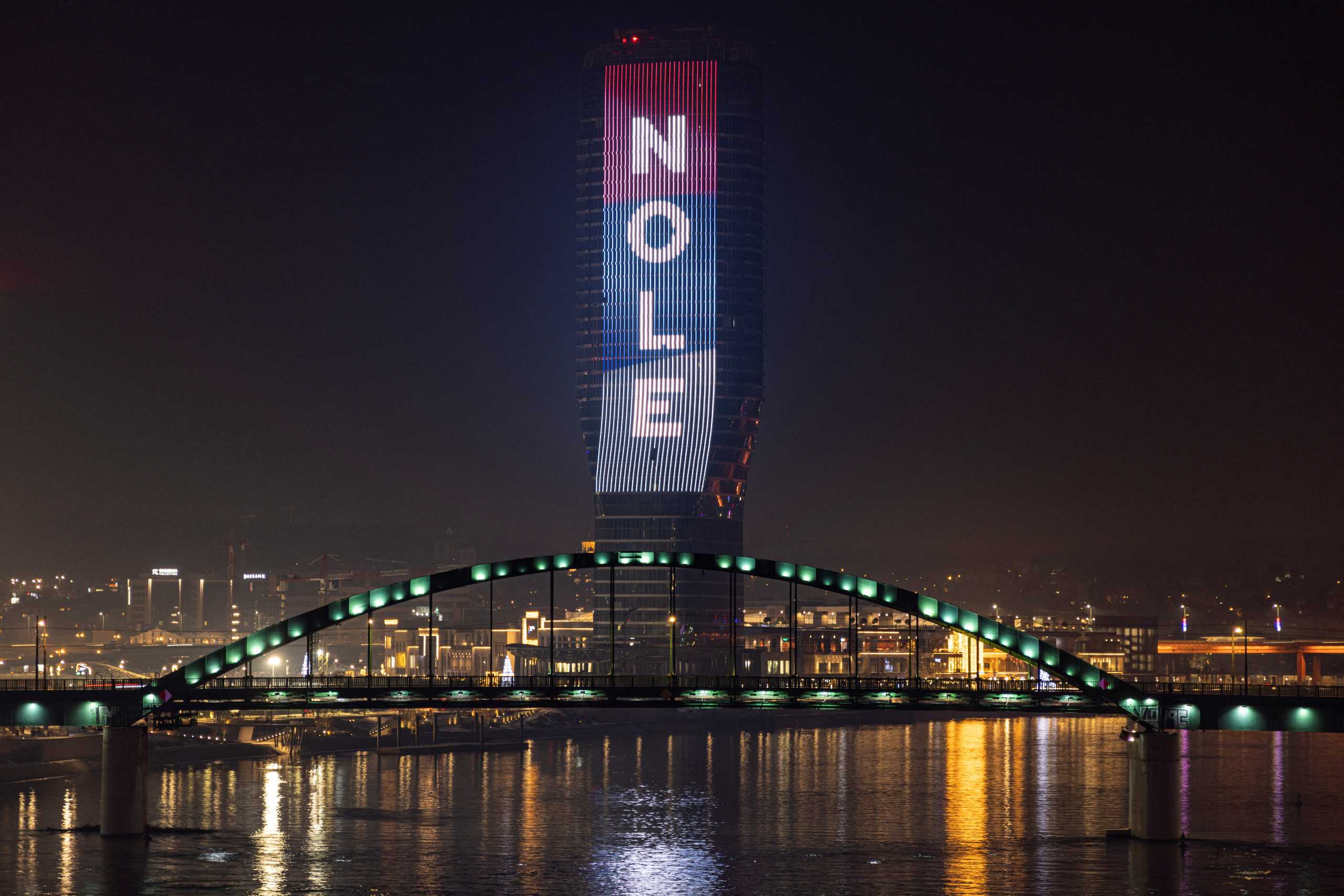 Belgrade Tower is illuminated in the national colours and a message reading "Nole" in support of tennis player Novak Djokovic in Belgrade, Serbia, January 16, 2022. REUTERS