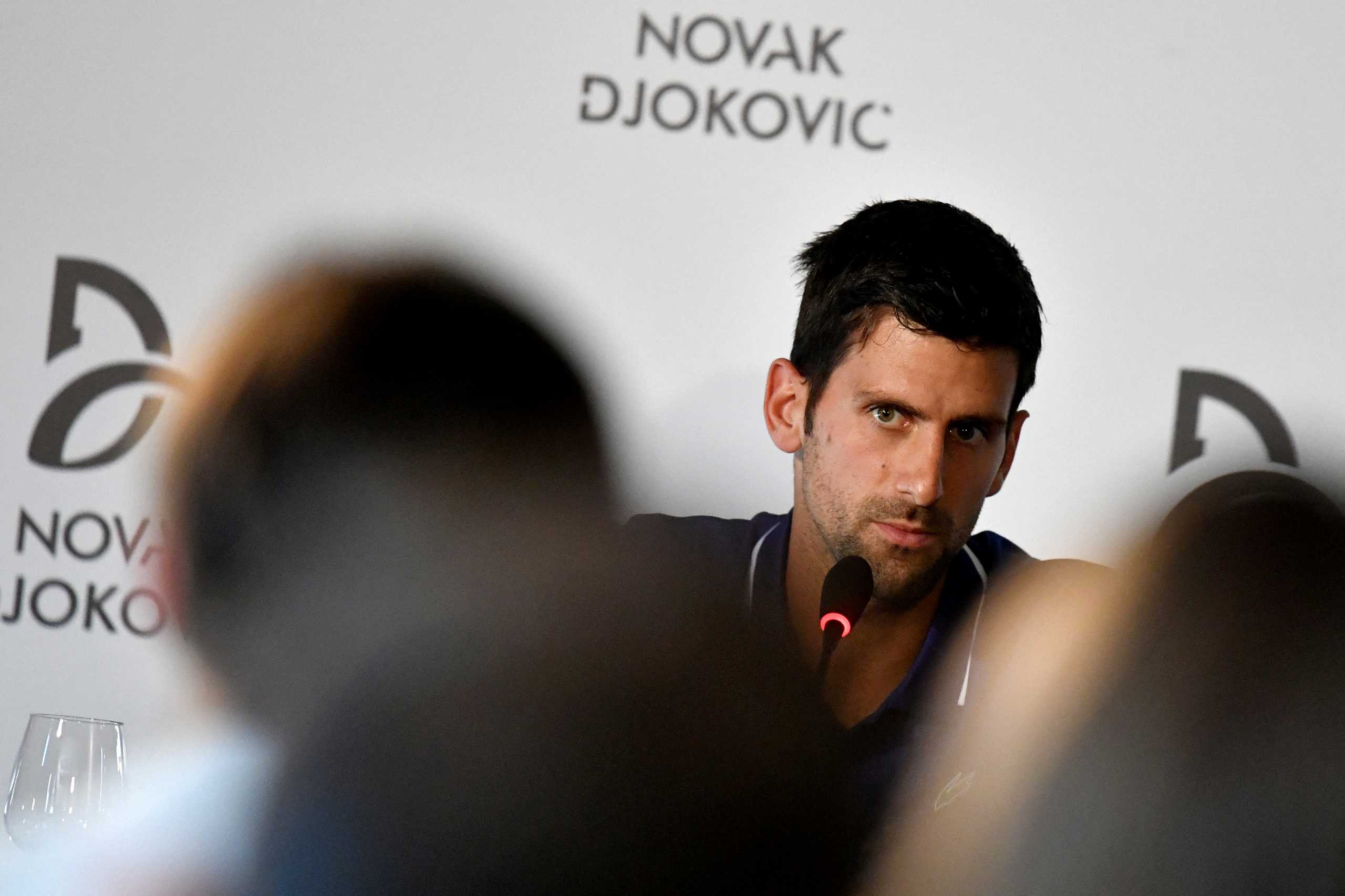 FILE PHOTO: FILE PHOTO: Former world No.1 tennis player Novak Djokovic speaks during a news conference in Belgrade, Serbia July 26, 2017. REUTERS