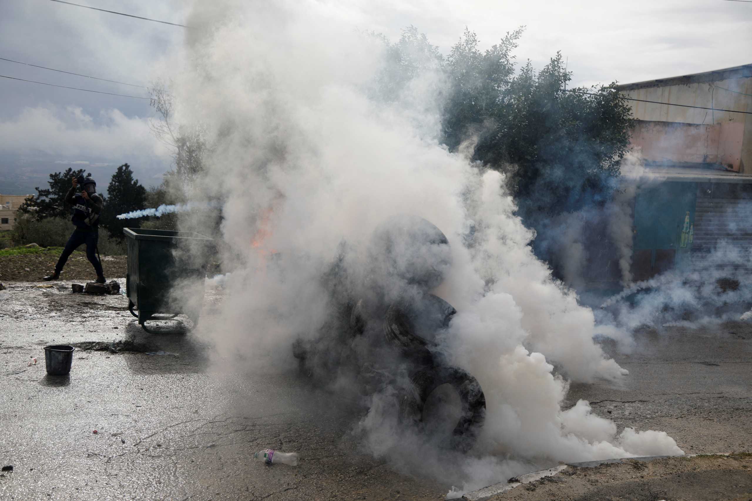 A barricade is set on fire during a protest against Jewish settlements, in Burqa village, in the Israeli-occupied West Bank December 23, 2021. REUTERS