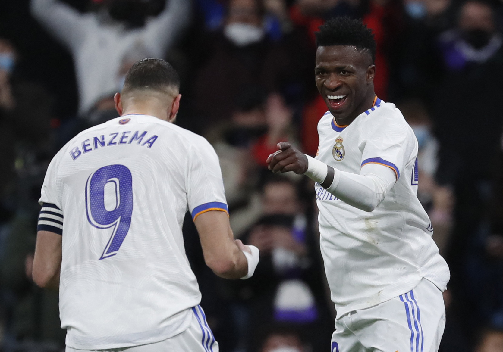 Soccer Football - LaLiga - Real Madrid v Valencia - Santiago Bernabeu, Madrid, Spain - January 8, 2022 Real Madrid's Vinicius Junior celebrates scoring their second goal with Karim Benzema REUTERS