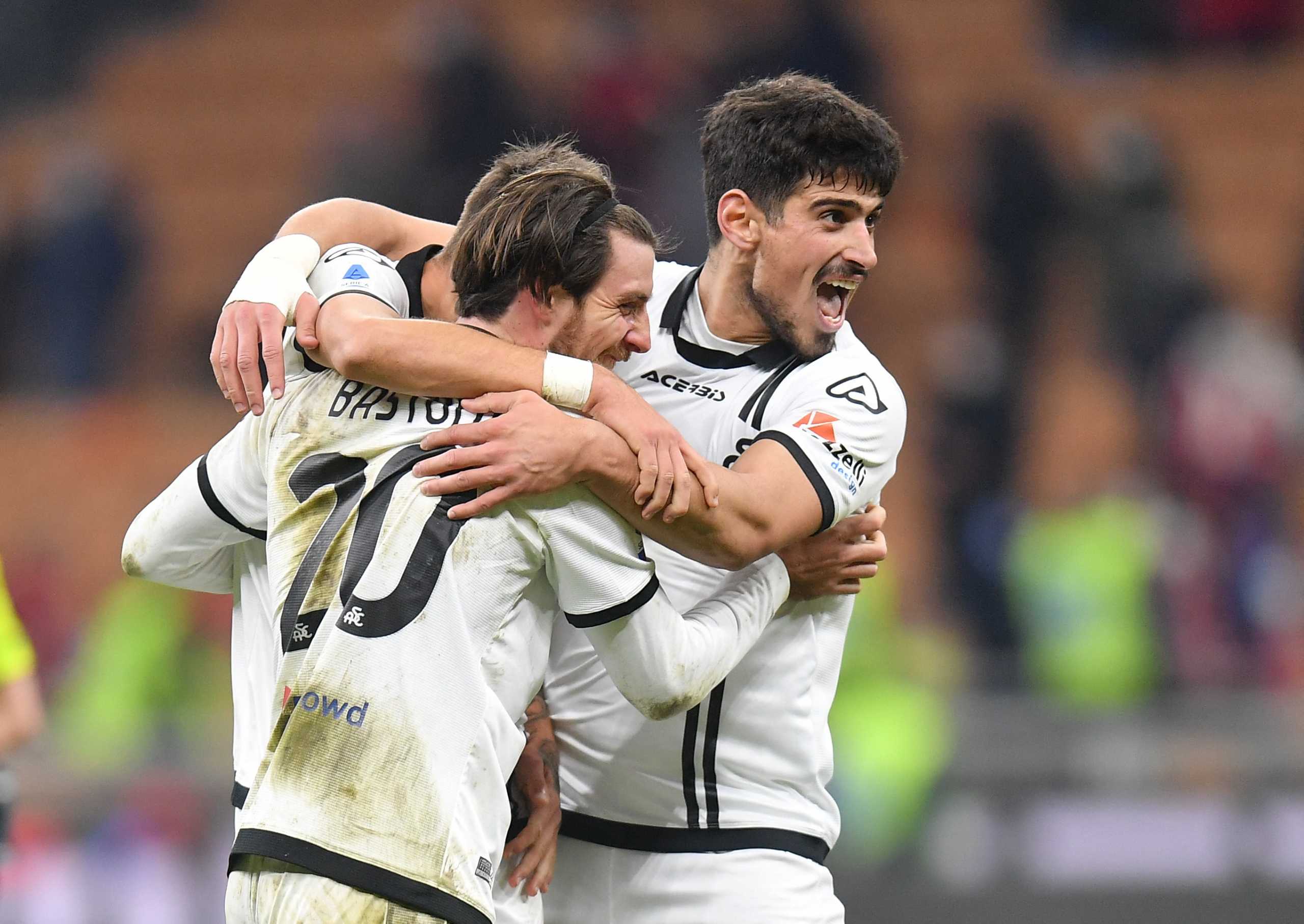 Soccer Football - Serie A - AC Milan v Spezia - San Siro, Milan, Italy - January 17, 2022 Spezia's Simone Bastoni and teammates celebrate their second goal scored by Emmanuel Gyasi REUTERS