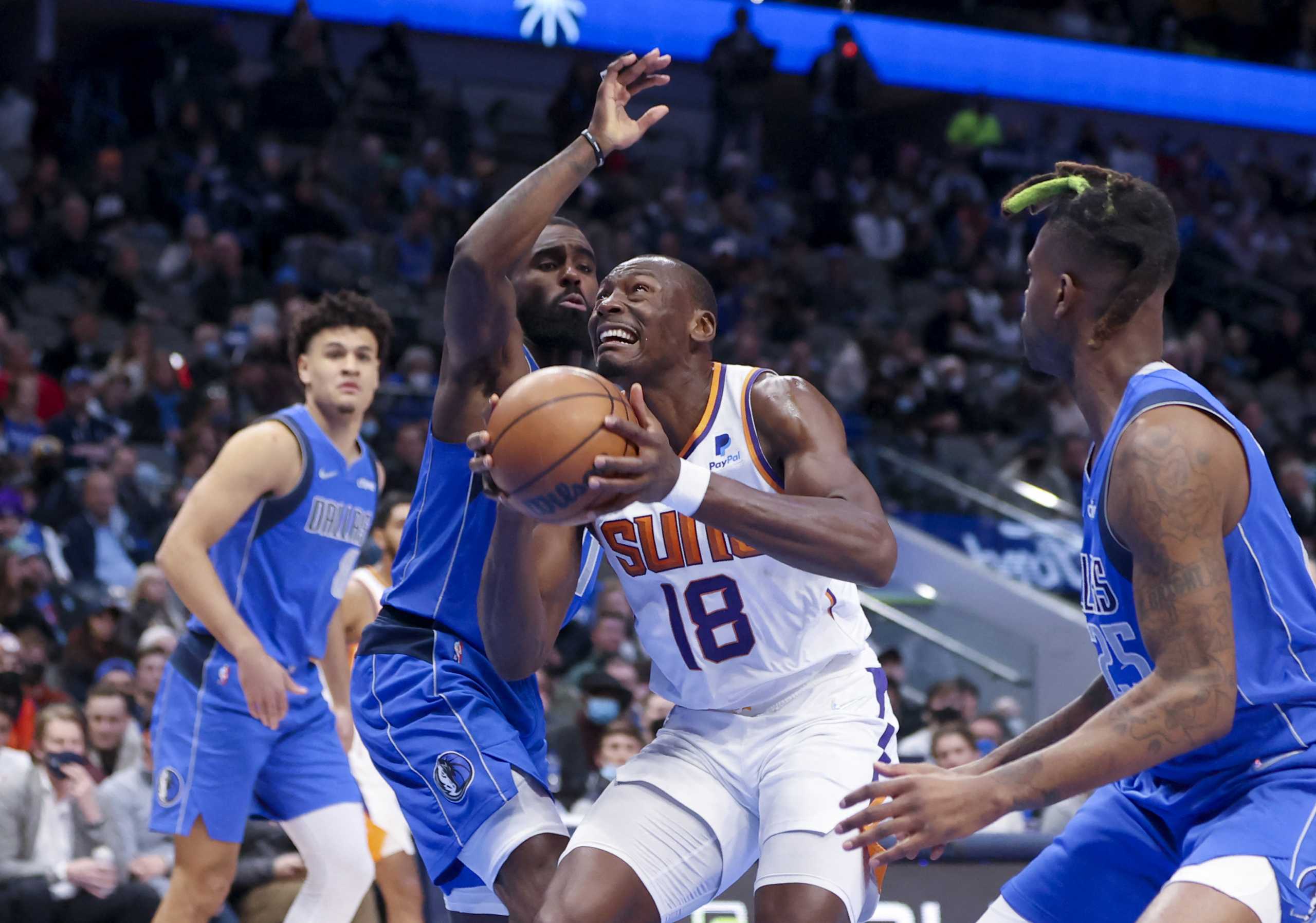 Jan 20, 2022; Dallas, Texas, USA;  Phoenix Suns center Bismack Biyombo (18) shoots over Dallas Mavericks forward Tim Hardaway Jr. (11) during the first half at American Airlines Center. Mandatory Credit: Kevin Jairaj-USA TODAY Sports