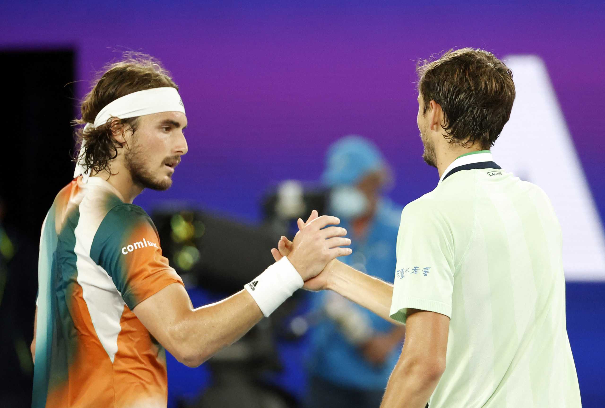 Tennis - Australian Open - Melbourne Park, Melbourne, Australia - January 28, 2022 Russia's Daniil Medvedev shakes hands with Greece's Stefanos Tsitsipas after winning their semi final match REUTERS