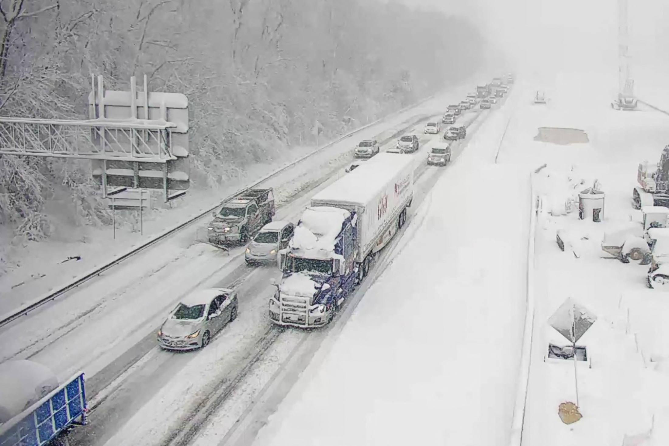 Vehicles are seen on an icy stretch of Interstate 95 closed as a storm blankets the U.S. region in snow, near Fredericksburg, Virginia, U.S. January 3, 2022. Picture taken January 3, 2022. Virginia Department of Transportation