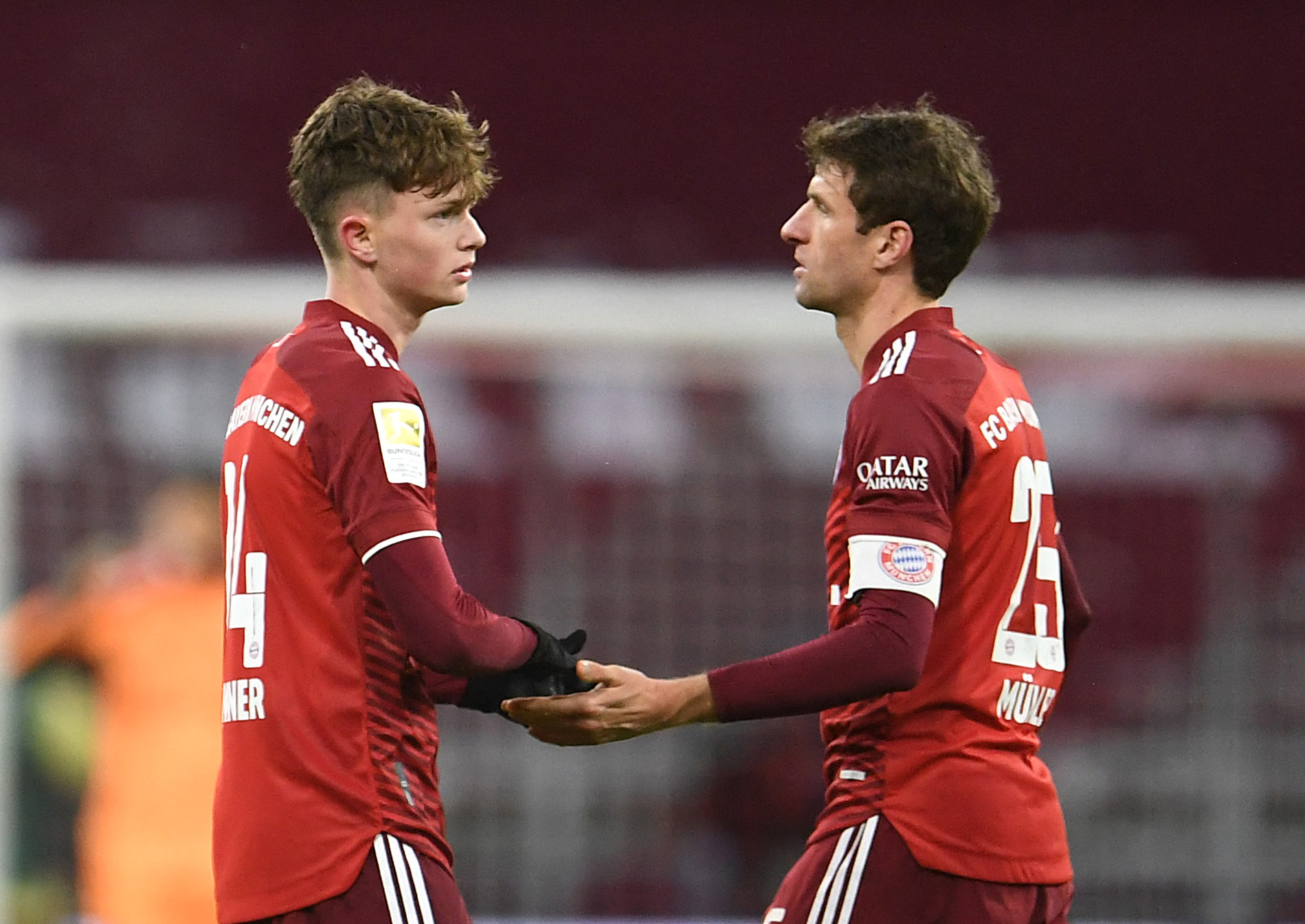 Soccer Football - Bundesliga - Bayern Munich v Borussia Moenchengladbach - Allianz Arena, Munich, Germany - January 7, 2022 Bayern Munich's Paul Wanner shakes hands with Thomas Muller after the match REUTERS