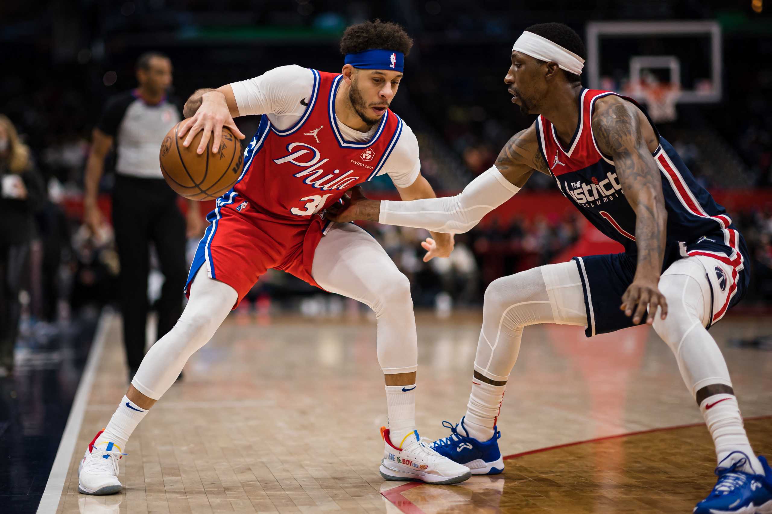 Jan 17, 2022; Washington, District of Columbia, USA;  Philadelphia 76ers guard Seth Curry (31) handles the ball as Washington Wizards forward Kentavious Caldwell-Pope (1) defends during the first half at Capital One Arena. Mandatory Credit: Scott Taetsch-USA TODAY Sports