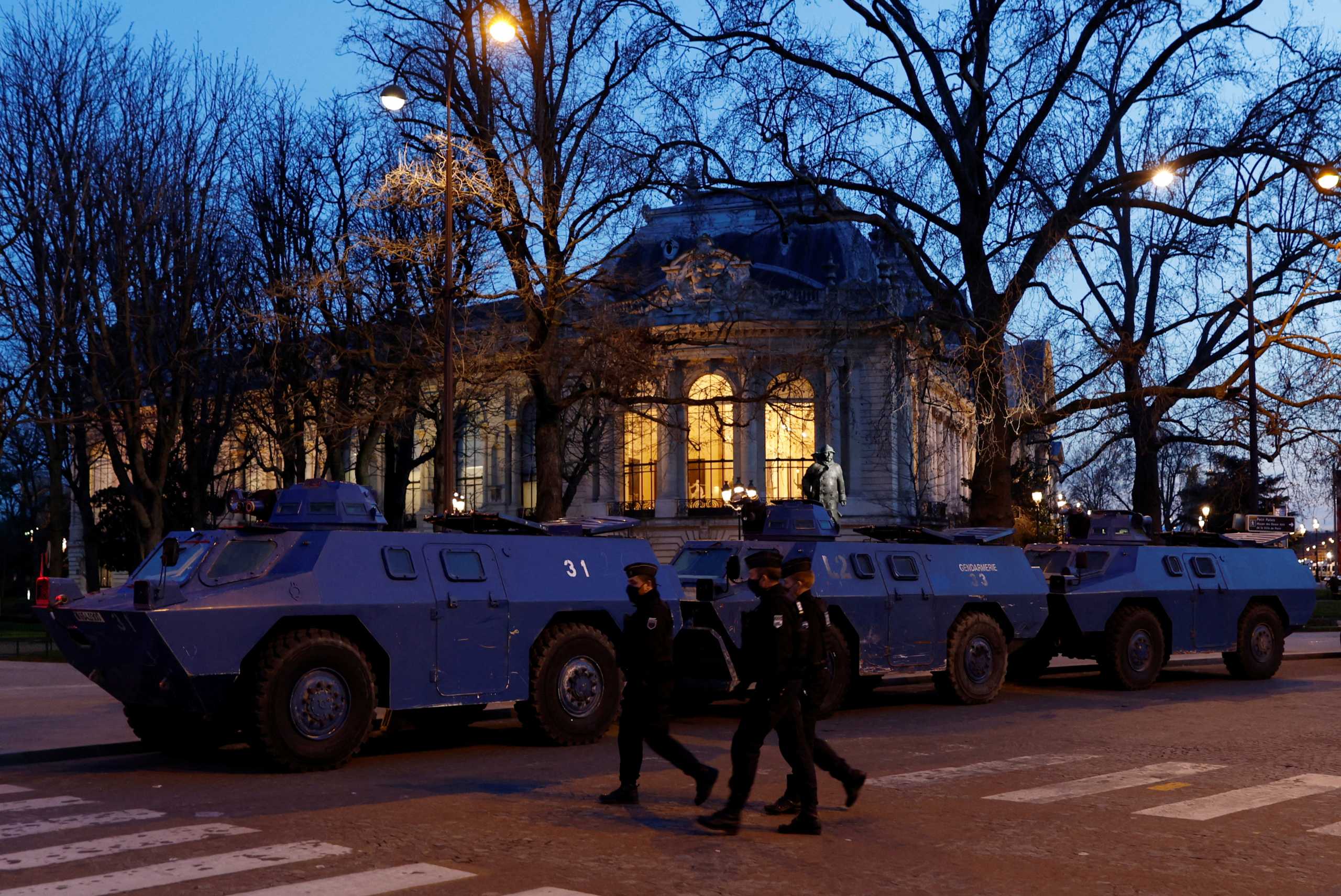 Armoured vehicles from the French Gendarmerie are in place along a street in front of the Petit Palais near the Champs Elysees avenue in Paris as French anti-COVID restrictions car drivers and their "Convoi de la liberte" (The Freedom Convoy), a vehicular convoy protest underway to Paris to protest coronavirus disease (COVID-19) vaccine and restrictions in France, February 11, 2022. REUTERS