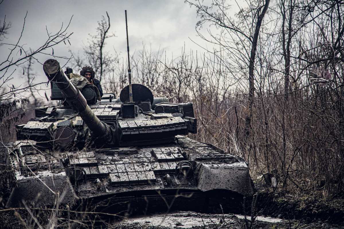 A service member of the Ukrainian Naval Infantry Corps (Marine Corps) rides a tank during drills at a training ground in an unknown location in Ukraine, in this handout picture released February 18, 2022. Press Service of the Ukrainian Naval Forces