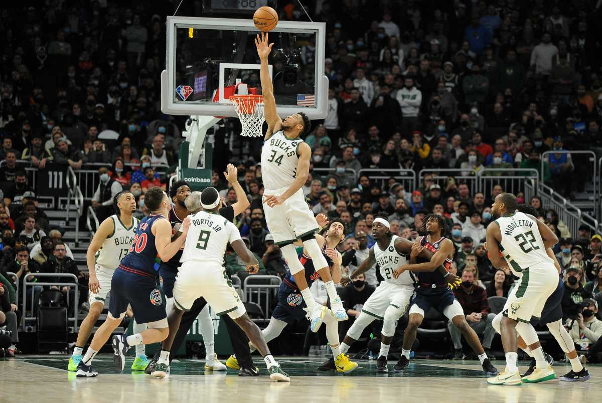 Feb 17, 2022; Milwaukee, Wisconsin, USA;  Milwaukee Bucks forward Giannis Antetokounmpo (34) goes up for a jump ball in the fourth quarter against the Philadelphia 76ers at Fiserv Forum. Mandatory Credit: Michael McLoone-USA TODAY Sports
