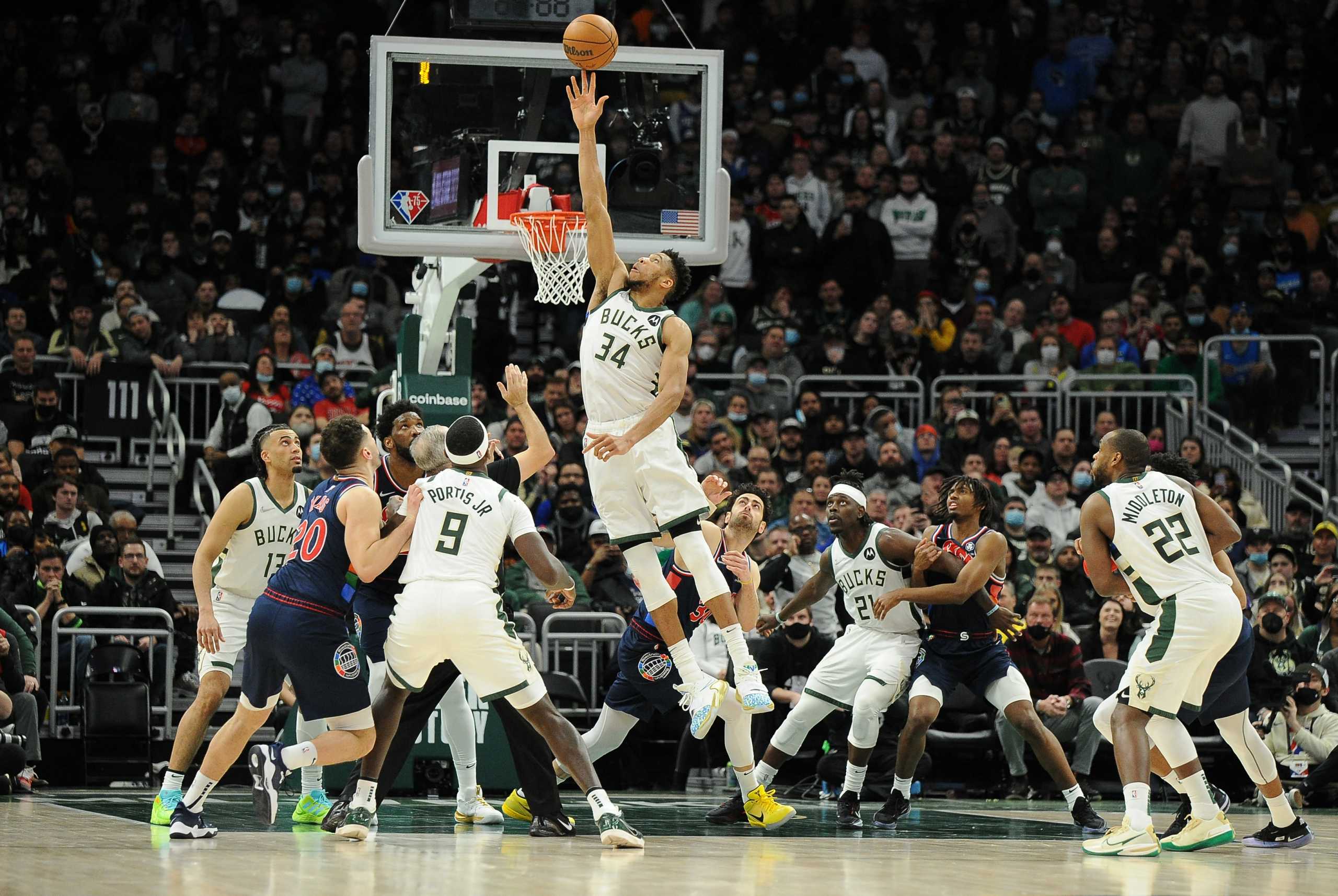 Feb 17, 2022; Milwaukee, Wisconsin, USA;  Milwaukee Bucks forward Giannis Antetokounmpo (34) goes up for a jump ball in the fourth quarter against the Philadelphia 76ers at Fiserv Forum. Mandatory Credit: Michael McLoone-USA TODAY Sports