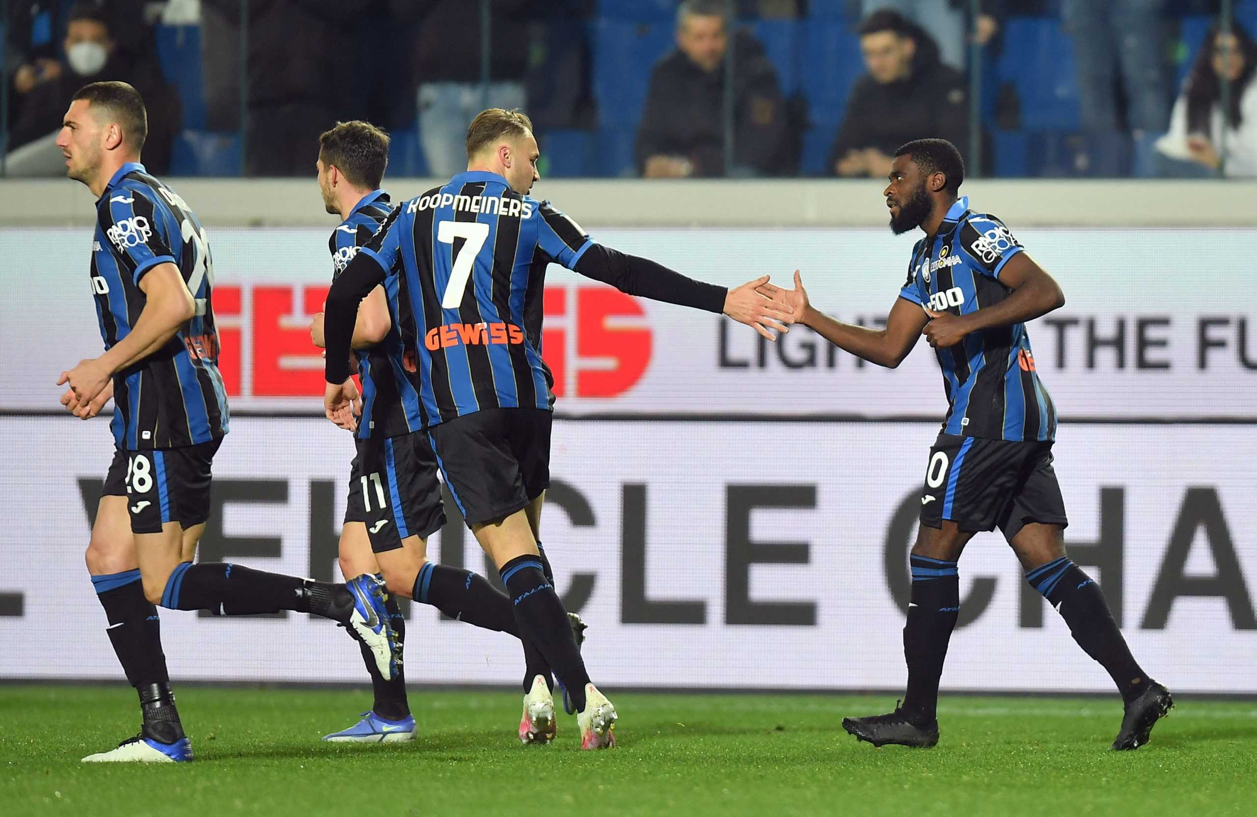 Soccer Football - Coppa Italia - Quarter Final - Atalanta v Fiorentina - Stadio Atleti Azzurri, Bergamo, Italy - February 10, 2022 Atalanta's Jeremie Boga celebrates scoring their second goal with Teun Koopmeiners and teammates REUTERS