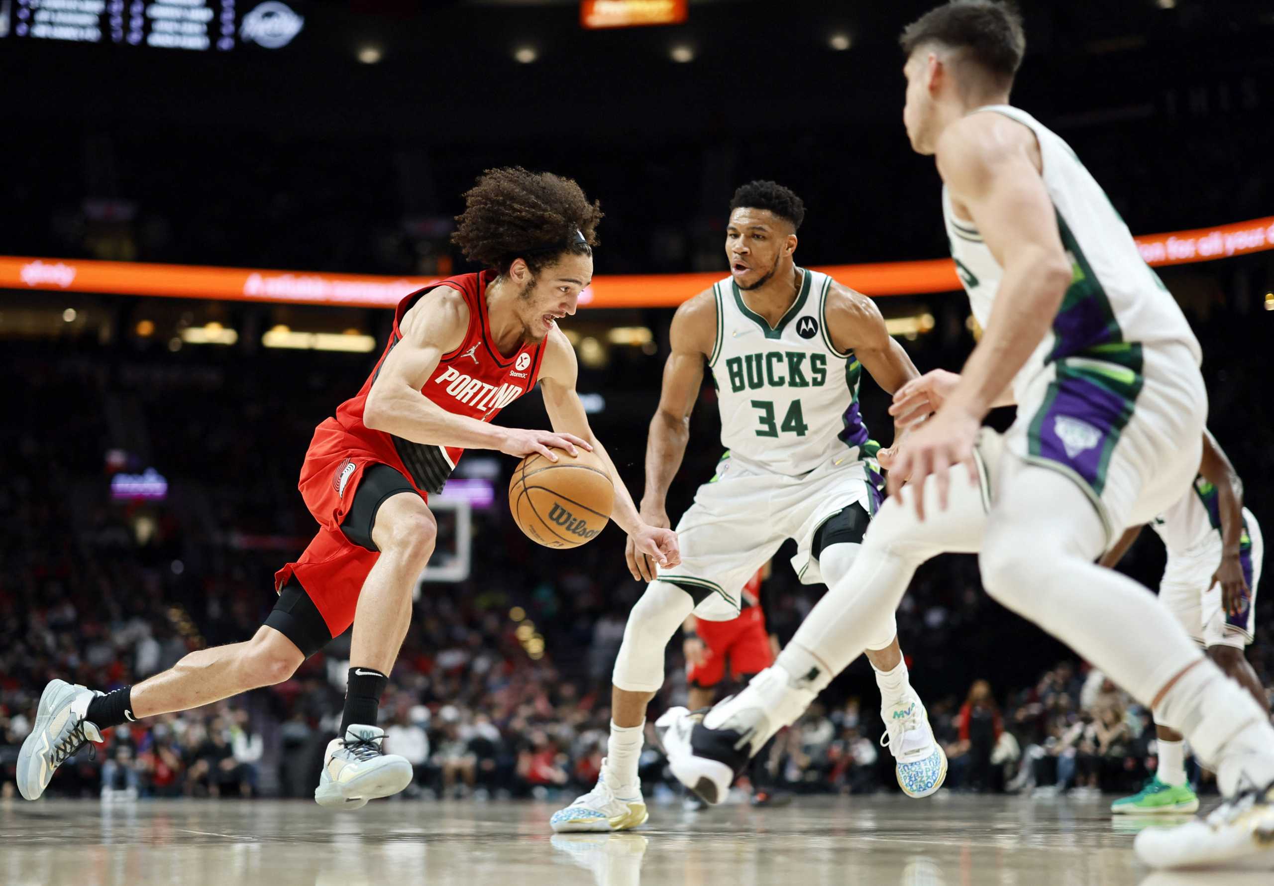 Feb 5, 2022; Portland, Oregon, USA; Portland Trail Blazers shooting guard CJ Elleby (16) drives to the basket against Milwaukee Bucks power forward Giannis Antetokounmpo (34) during the second half at Moda Center. Mandatory Credit: Soobum Im-USA TODAY Sports