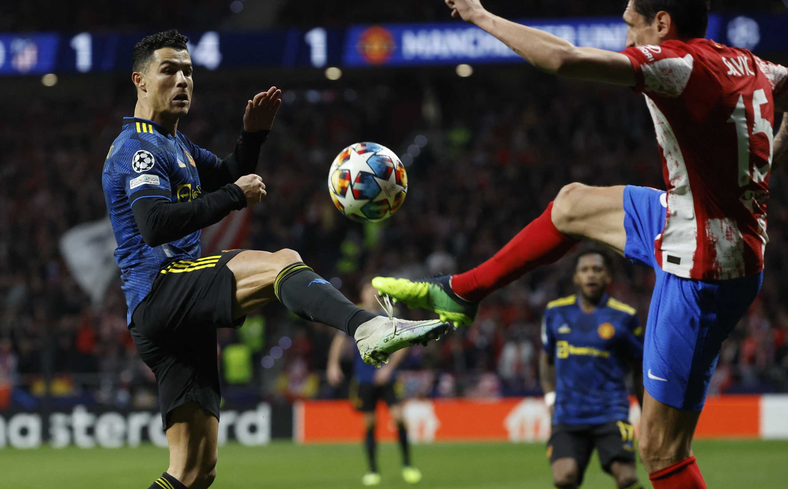 Soccer Football - Champions League - Round of 16 First Leg - Atletico Madrid v Manchester United - Wanda Metropolitano, Madrid, Spain - February 23, 2022 Atletico Madrid's Stefan Savic in action with Manchester United's Cristiano Ronaldo REUTERS