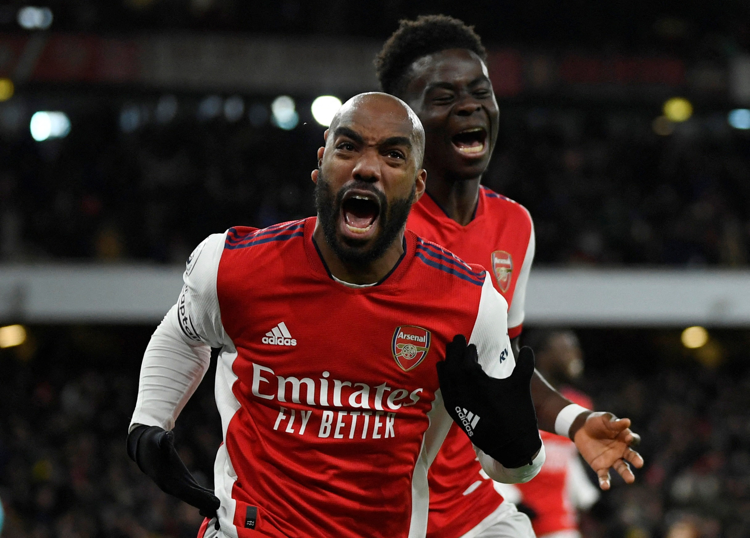 Soccer Football - Premier League - Arsenal v Wolverhampton Wanderers - Emirates Stadium, London, Britain - February 24, 2022  Arsenal's Alexandre Lacazette celebrates scoring their second goal with Bukayo Saka REUTERS