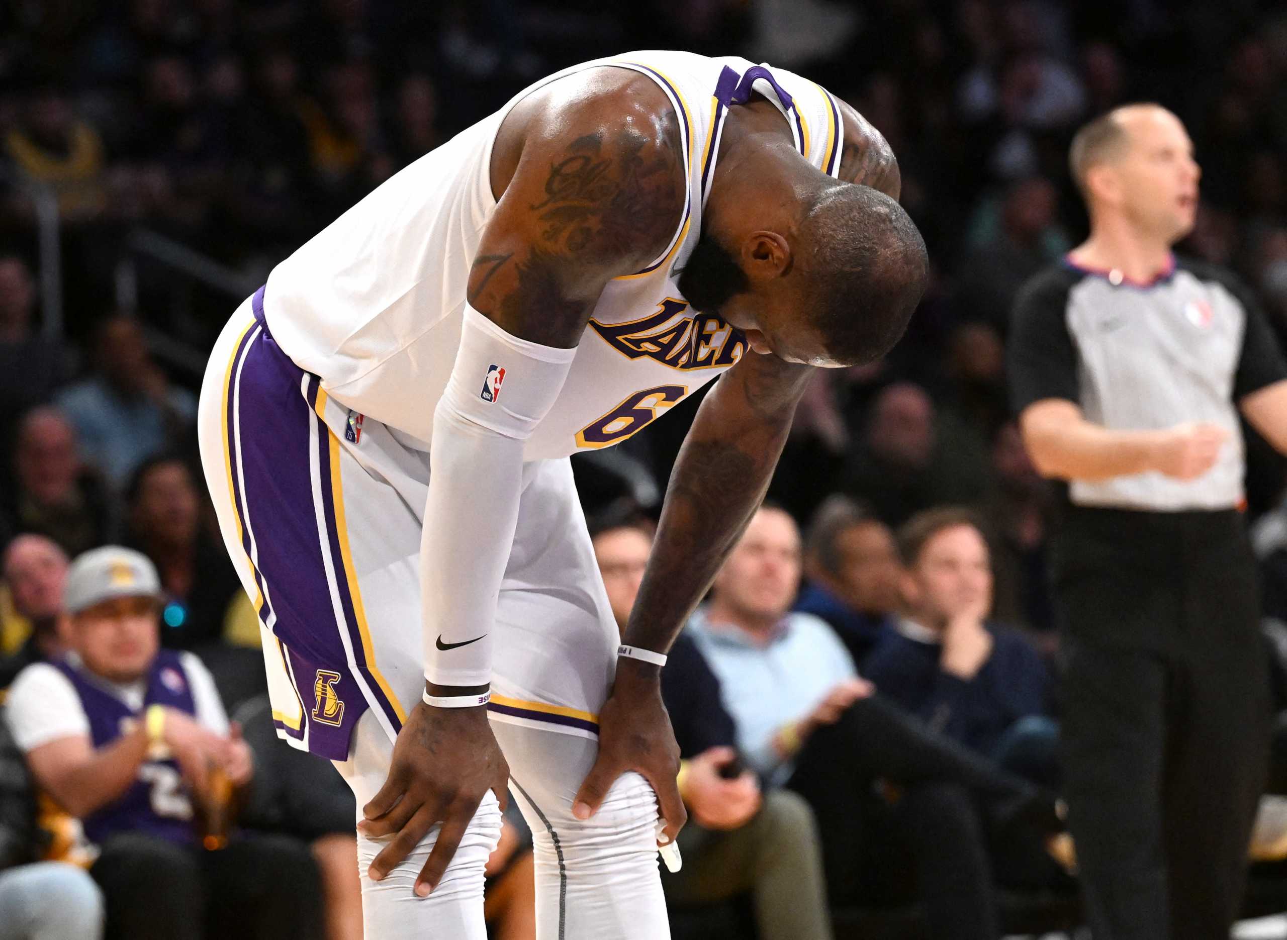 Feb 27, 2022; Los Angeles, California, USA; Los Angeles Lakers forward LeBron James (6) rests his hands on his leg during a time out in the second half against the New Orleans Pelicans at Crypto.com Arena. Mandatory Credit: Jayne Kamin-Oncea-USA TODAY Sports