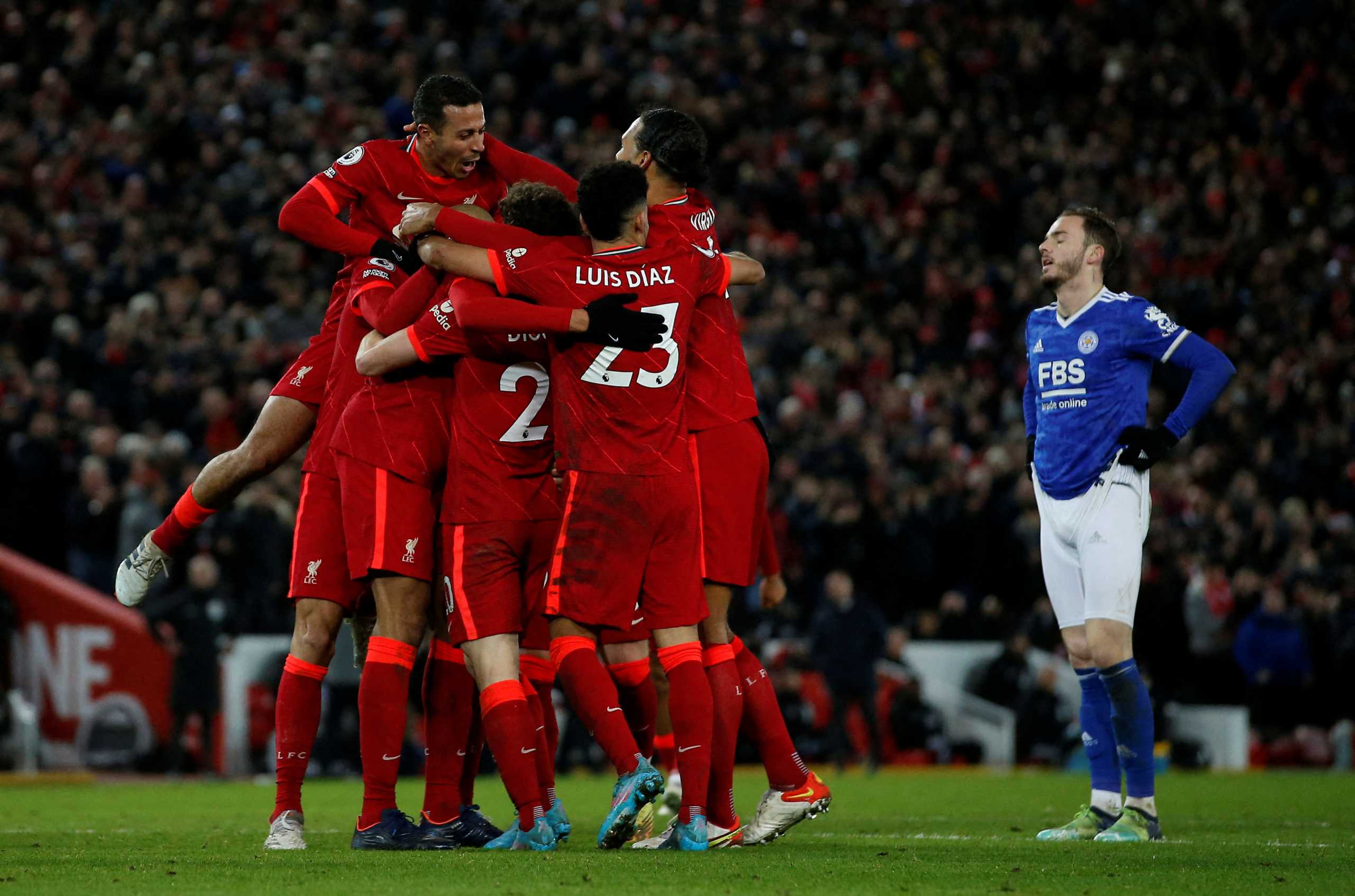 Soccer Football - Premier League - Liverpool v Leicester City - Anfield, Liverpool, Britain - February 10, 2022 Liverpool's Diogo Jota celebrates scoring their second goal with teammates REUTERS