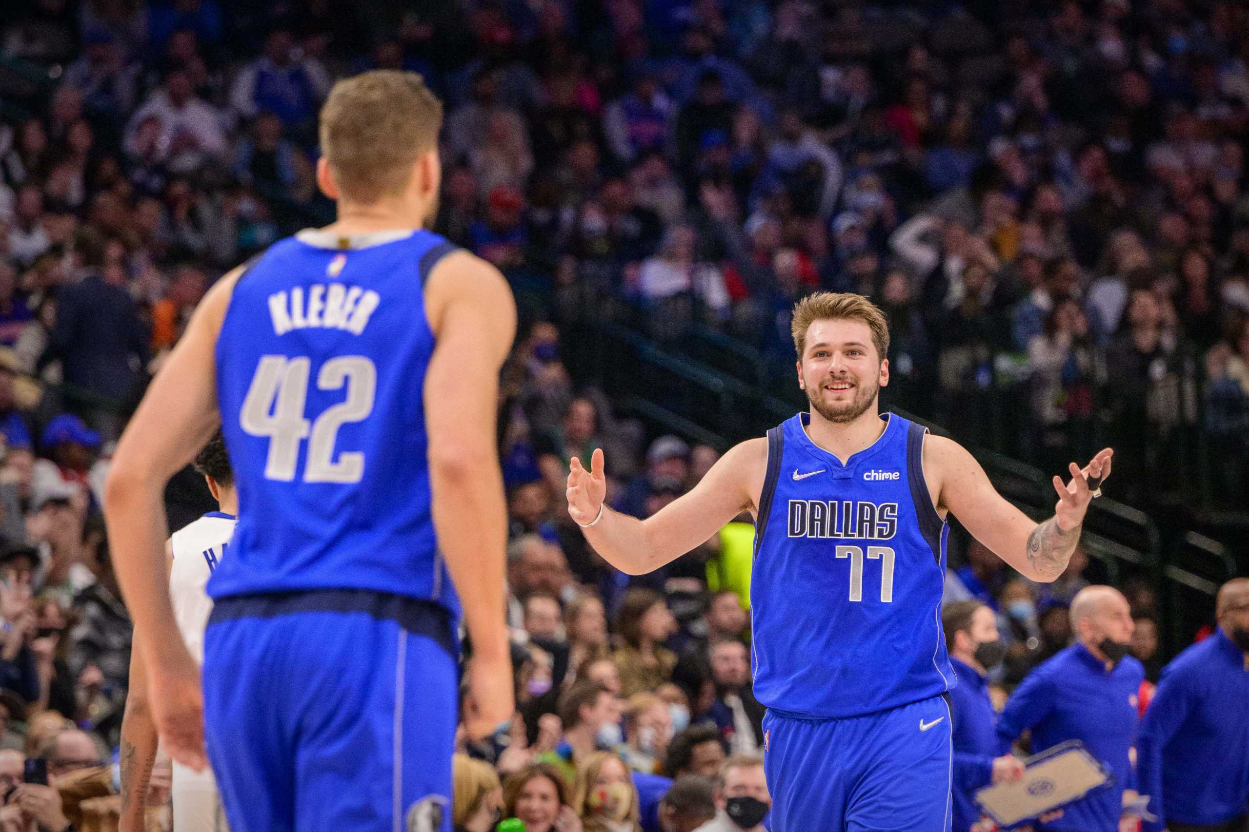 Feb 8, 2022; Dallas, Texas, USA; Dallas Mavericks forward Maxi Kleber (42) and guard Luka Doncic (77) celebrate during the second half against the Detroit Pistons at the American Airlines Center. Mandatory Credit: Jerome Miron-USA TODAY Sports