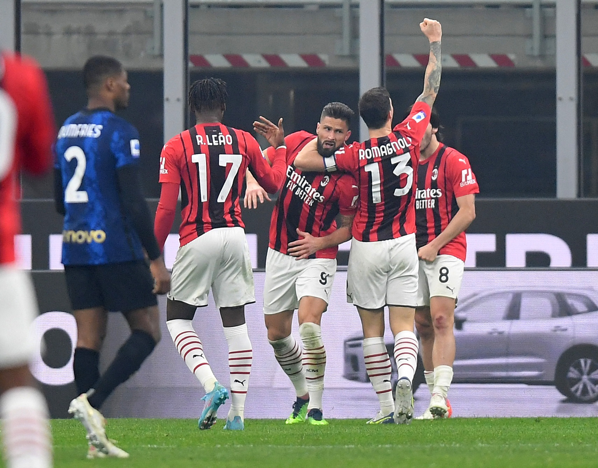 Soccer Football - Serie A - Inter Milan v AC Milan - San Siro, Milan, Italy - February 5, 2022  AC Milan's Olivier Giroud celebrates scoring their first goal with teammates REUTERS