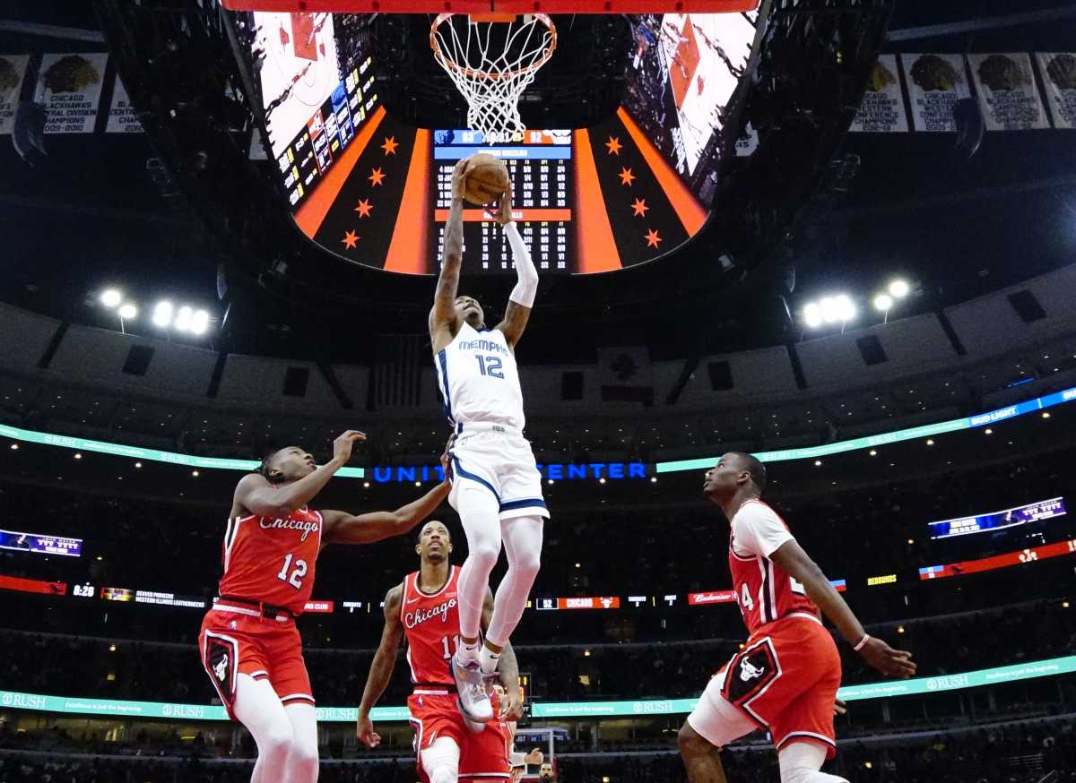 Feb 26, 2022; Chicago, Illinois, USA; Chicago Bulls guard Ayo Dosunmu (12) defends Memphis Grizzlies guard Ja Morant (12) during the second half at United Center. Mandatory Credit: David Banks-USA TODAY Sports