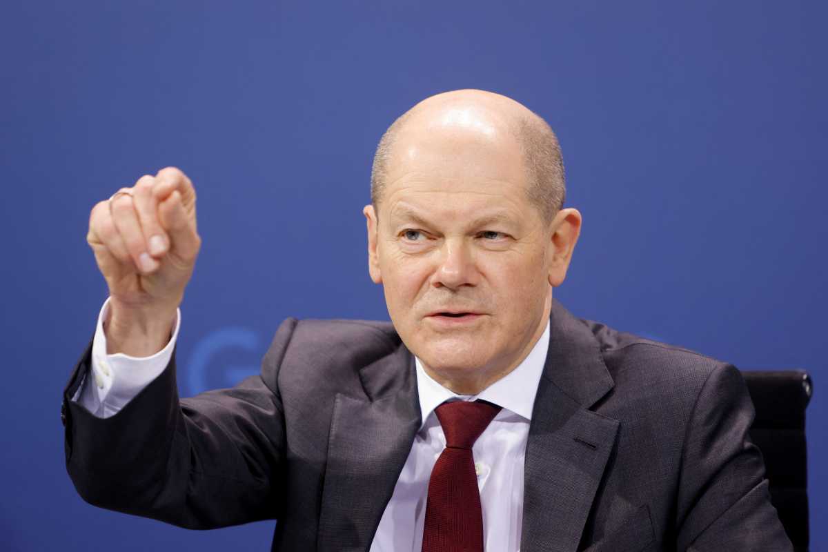 German Chancellor Olaf Scholz gestures during a news conference with Berlin Mayor Franziska Giffey and state premier of North Rhine-Westphalia Hendrik Wuest, following a meeting with the 16 state leaders on latest coronavirus disease (COVID-19) measures in Berlin, Germany February 16, 2022. REUTERS