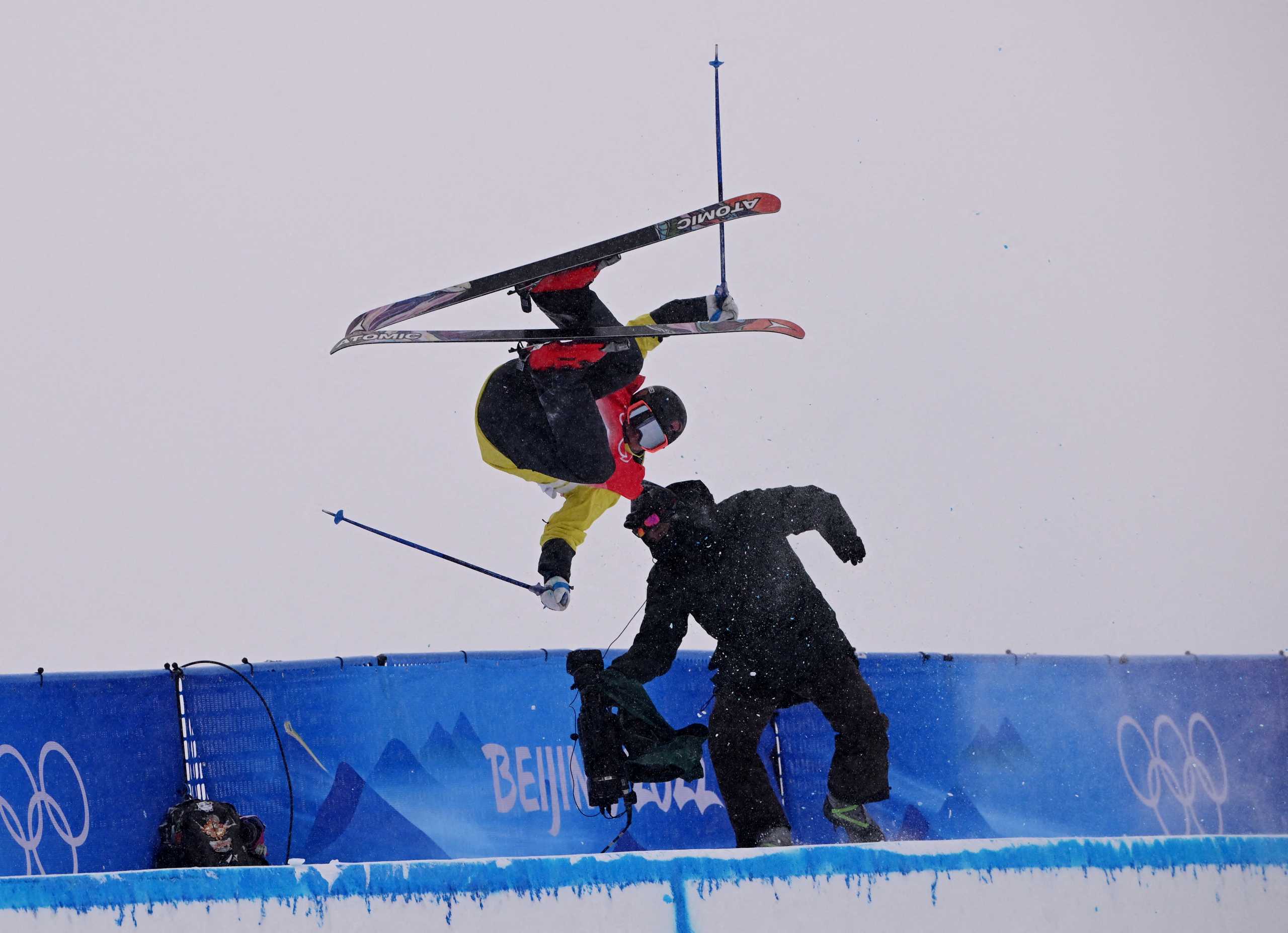 2022 Beijing Olympics - Freestyle Skiing - Men's Freeski - Halfpipe - Qualification - Run 1 - Genting Snow Park, Zhangjiakou, China - February 17, 2022. Jon Sallinen of Finland collides with the camera operator during his run. REUTERS