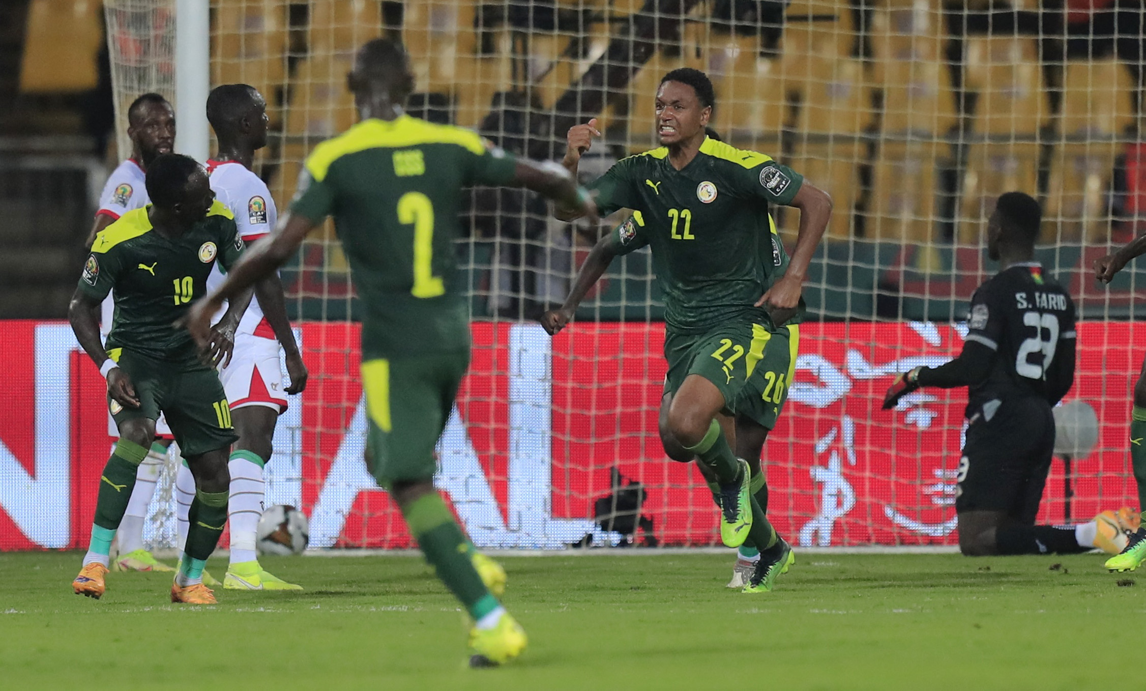 Soccer Football - Africa Cup of Nations -  Semi Final - Burkina Faso v Senegal -  Ahmadou Ahidjo Stadium, Yaounde, Cameroon - February 2, 2022 Senegal's Abdou Diallo celebrates scoring their first goal with teammates REUTERS