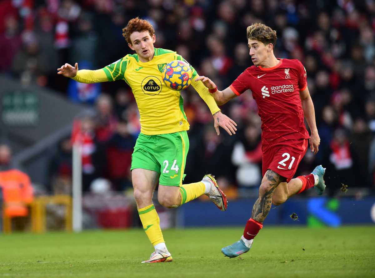 Soccer Football - Premier League - Liverpool v Norwich City - Anfield, Liverpool, Britain - February 19, 2022 Liverpool's Kostas Tsimikas in action with Norwich City's Josh Sargent REUTERS