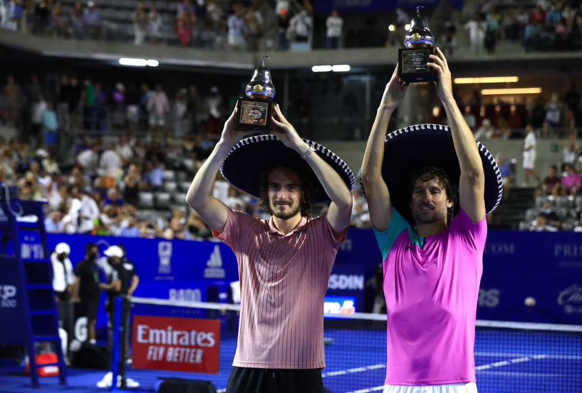 Tennis - ATP 500 - Abierto Mexicano - The Fairmont Acapulco Princess, Acapulco, Mexico - February 26, 2022 Greece's Stefanos Tsitsipas and Spain's Feliciano Lopez celebrate with their trophies after winning the doubles final against the Netherland's Jean-Julien Rojer and El Salvador's Marcelo Arevalo REUTERS