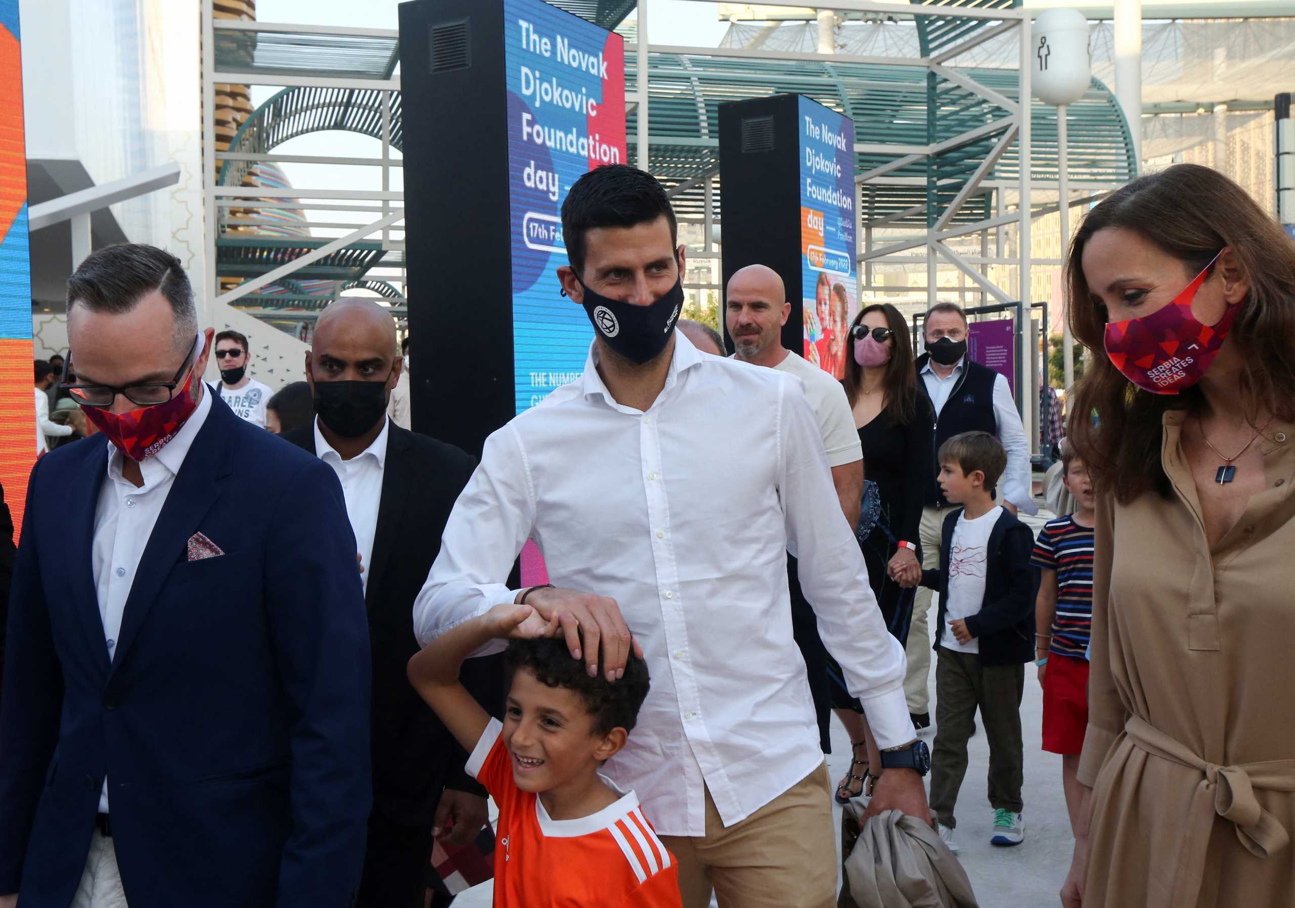 Tennis player Novak Djokovic wears a mask as he visits the Serbia pavilion at Expo 2020 for the presentation of the Novak Djokovic Foundation, in Dubai, United Arab Emirates, February 17, 2022. REUTERS