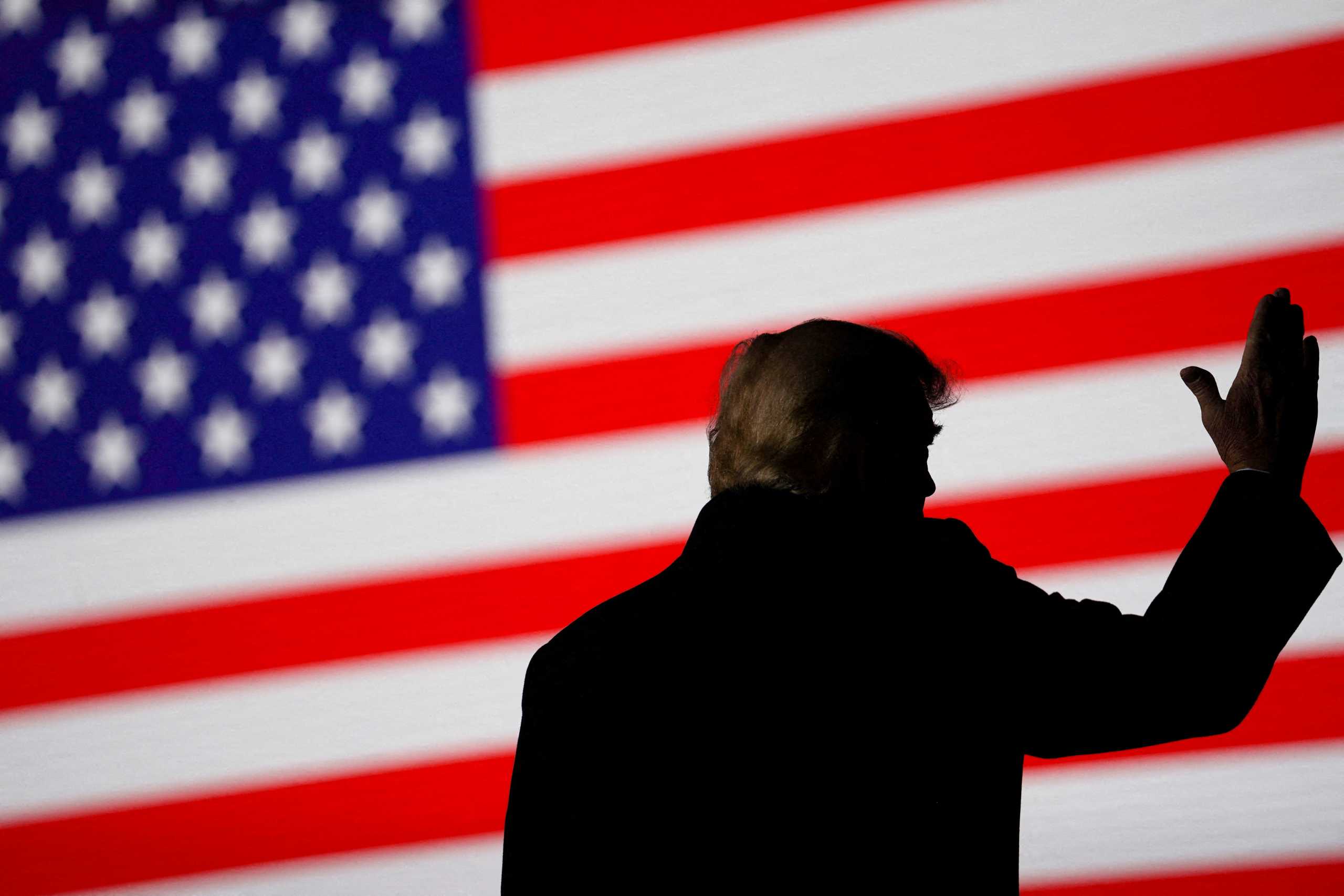 FILE PHOTO: Former U.S. President Donald Trump gestures during a rally in Conroe, Texas, U.S., January 29, 2022. REUTERS