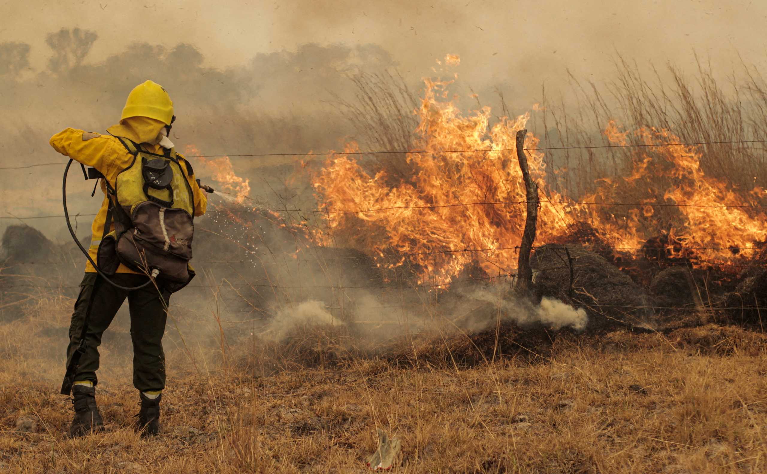 FILE PHOTO: A firefighter battles a wildfire in Corrientes, Argentina, February 15, 2022.  REUTERS