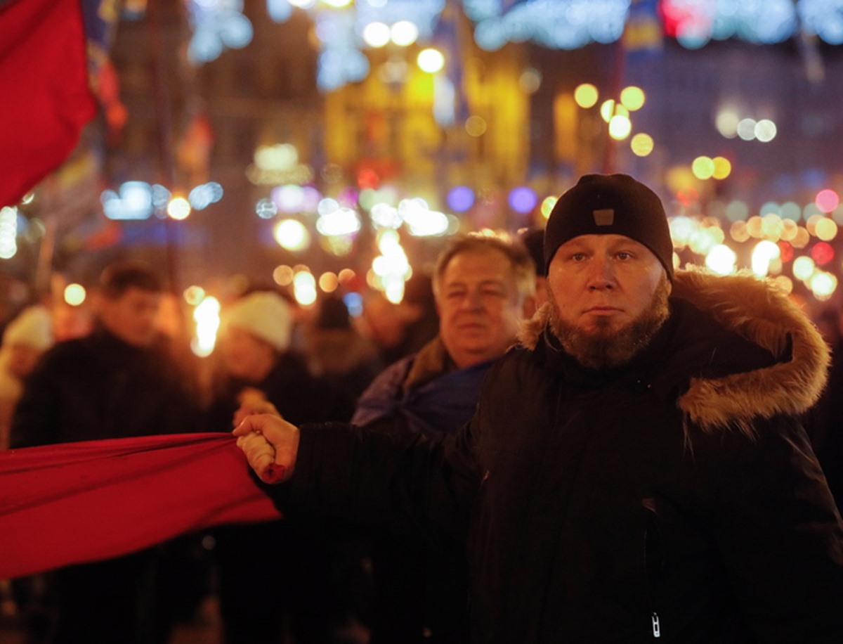 epa09663039 Marching people carry torches and nationalist flags of far-right ultranationalist political party Svoboda during a rally of various nationalist parties to mark the 113th birthday of Stepan Bandera, in Kiev, Ukraine, 01 January 2022. Stepan Bandera was born on 01 January 1909 in what was then Galicia and Lodomeria and became a leader of the Ukrainian ultranationalist far-right Organization of Ukrainian Nationalists (OUN) and OUN-B. He was responsible for the proclamation of an independent Ukrainian state in Lviv on 30 June 1941, accompanied by the arrival of Nazi Germany troops. KGB agents assassinated him in his Munich, West Germany exile on 15 October 1959.  EPA