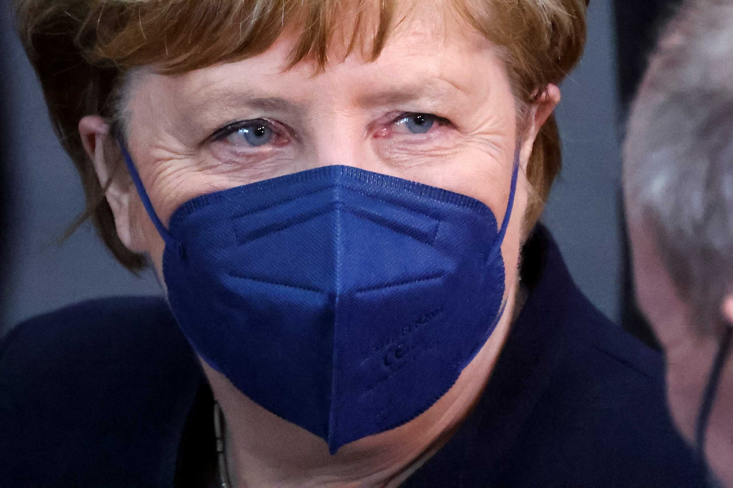 Former Chancellor Angela Merkel looks on at the Bundestag building Paul Loebe Haus, as the Federal Assembly gathers to elect the new German state president, in Berlin, Germany February 13, 2022. REUTERS