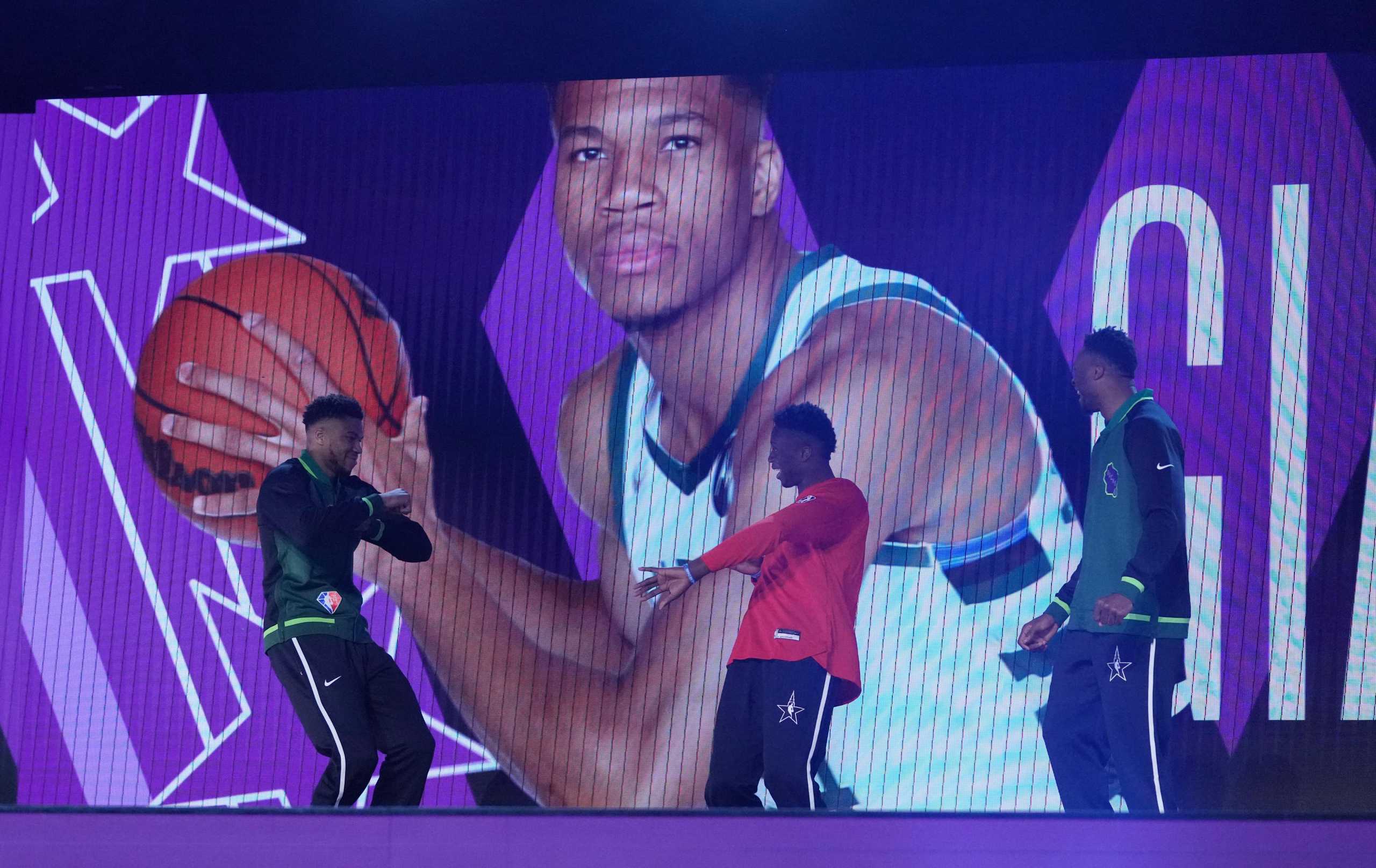 Feb 19, 2022; Cleveland, OH, USA; Team Antetokounmpo player Giannis Antetokounmpo (left) is introduced with his brothers during the Skills Challenge during the 2022 NBA All-Star Saturday Night at Rocket Mortgage Field House. Mandatory Credit: Kyle Terada-USA TODAY Sports