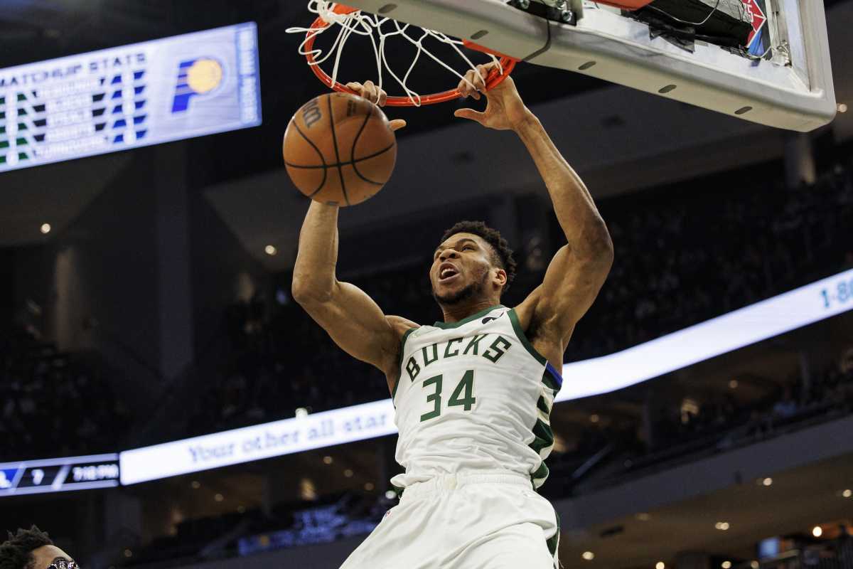 Feb 15, 2022; Milwaukee, Wisconsin, USA;  Milwaukee Bucks forward Giannis Antetokounmpo (34) dunks during the first quarter against the Indiana Pacers at Fiserv Forum. Mandatory Credit: Jeff Hanisch-USA TODAY Sports