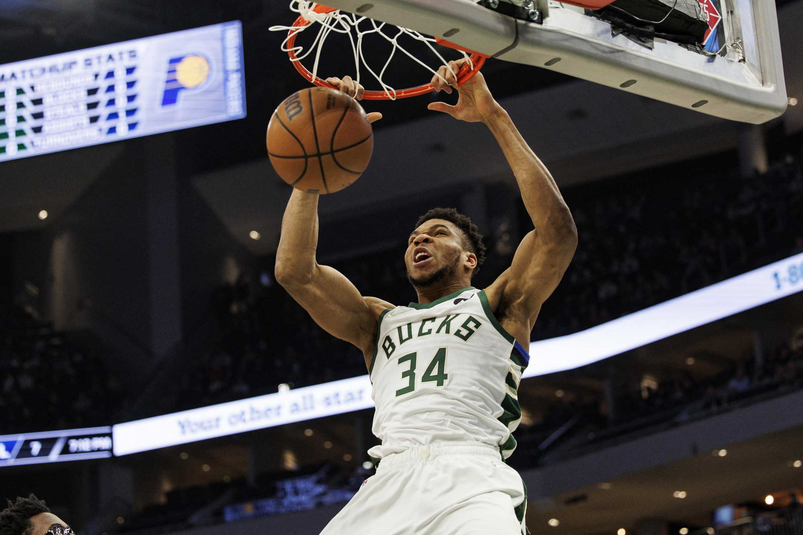 Feb 15, 2022; Milwaukee, Wisconsin, USA;  Milwaukee Bucks forward Giannis Antetokounmpo (34) dunks during the first quarter against the Indiana Pacers at Fiserv Forum. Mandatory Credit: Jeff Hanisch-USA TODAY Sports