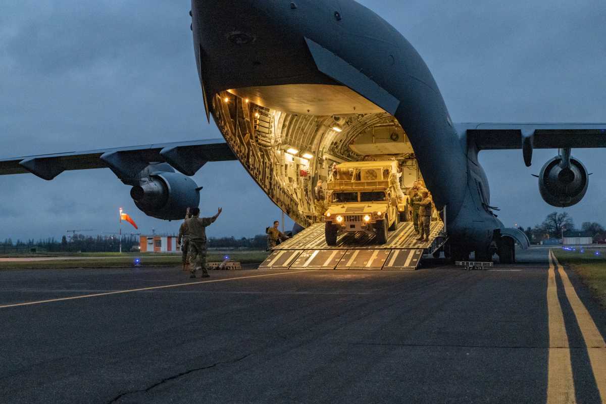 Airmen from the 521st Air Mobility Operations Wing, some of the first U.S. troops to arrive in Europe following the Pentagon's announcement of additional forces moving from the United States to Europe in support of NATO, amid rising tensions between Ukraine and Russia, disembark in Wiesbaden, Germany, February 4, 2022.  U.S. Army