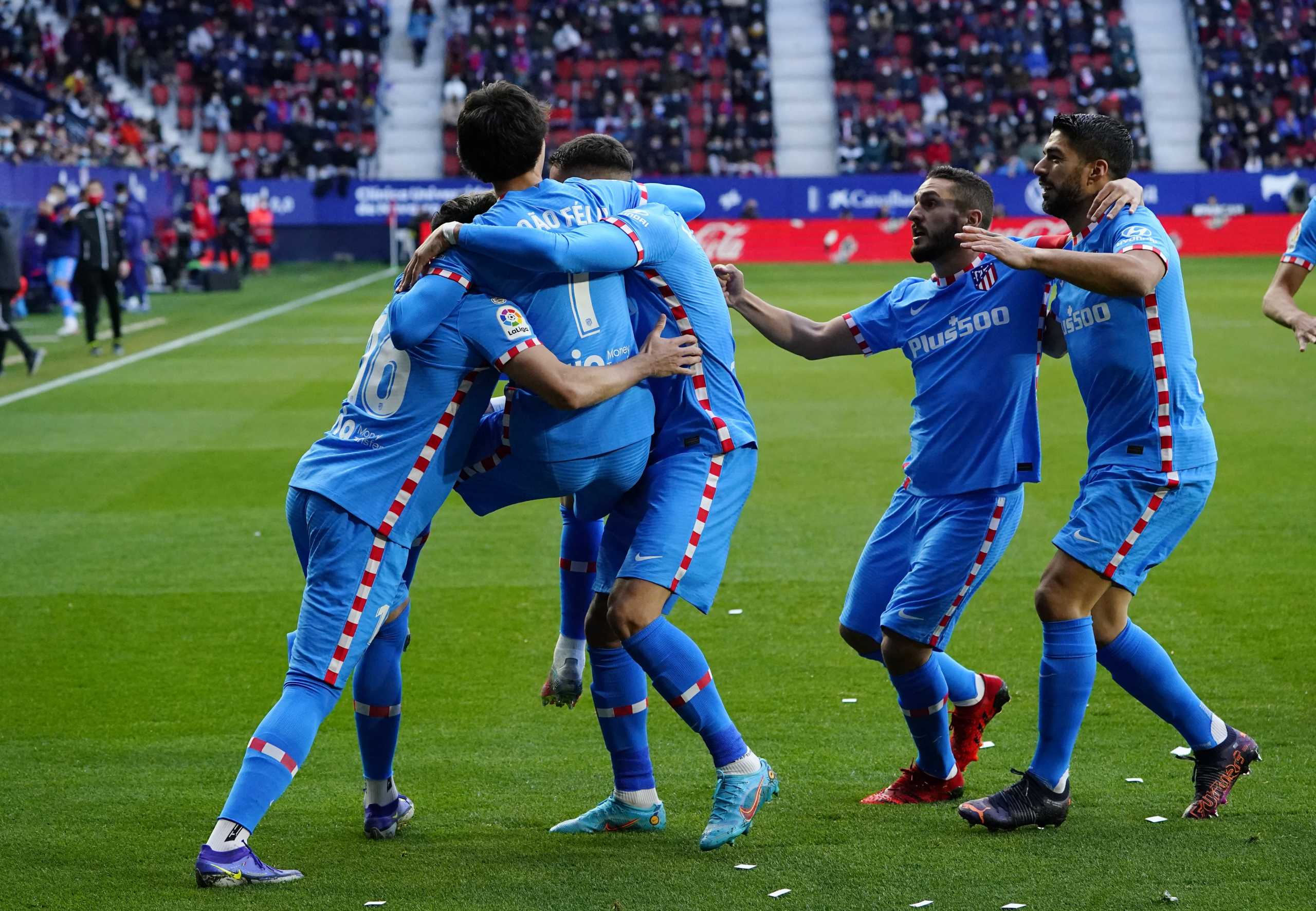 Soccer Football - LaLiga - Osasuna v Atletico Madrid - El Sadar Stadium, Pamplona, Spain - February 19, 2022 Atletico Madrid's Joao Felix celebrates scoring their first goal with teammates REUTERS
