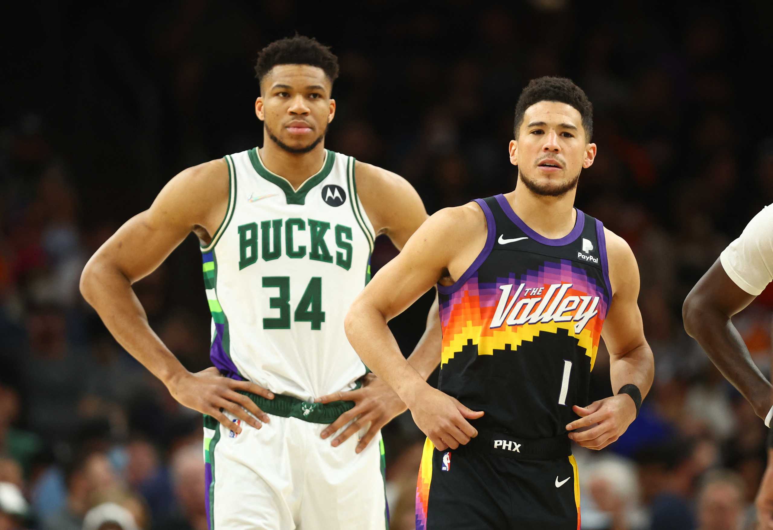 Feb 10, 2022; Phoenix, Arizona, USA; Phoenix Suns guard Devin Booker (1) alongside Milwaukee Bucks forward Giannis Antetokounmpo (34) in the first half at Footprint Center. Mandatory Credit: Mark J. Rebilas-USA TODAY Sports