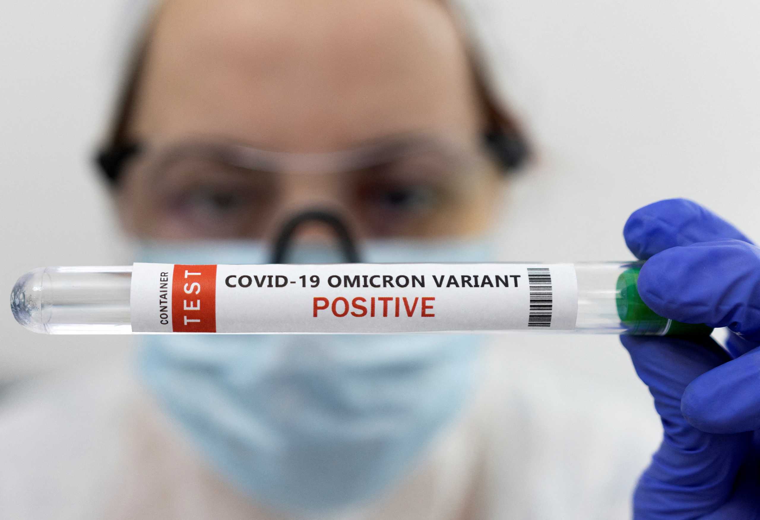 Test tube labelled "COVID-19 Omicron variant test positive" is seen in this illustration picture taken January 15, 2022. REUTERS