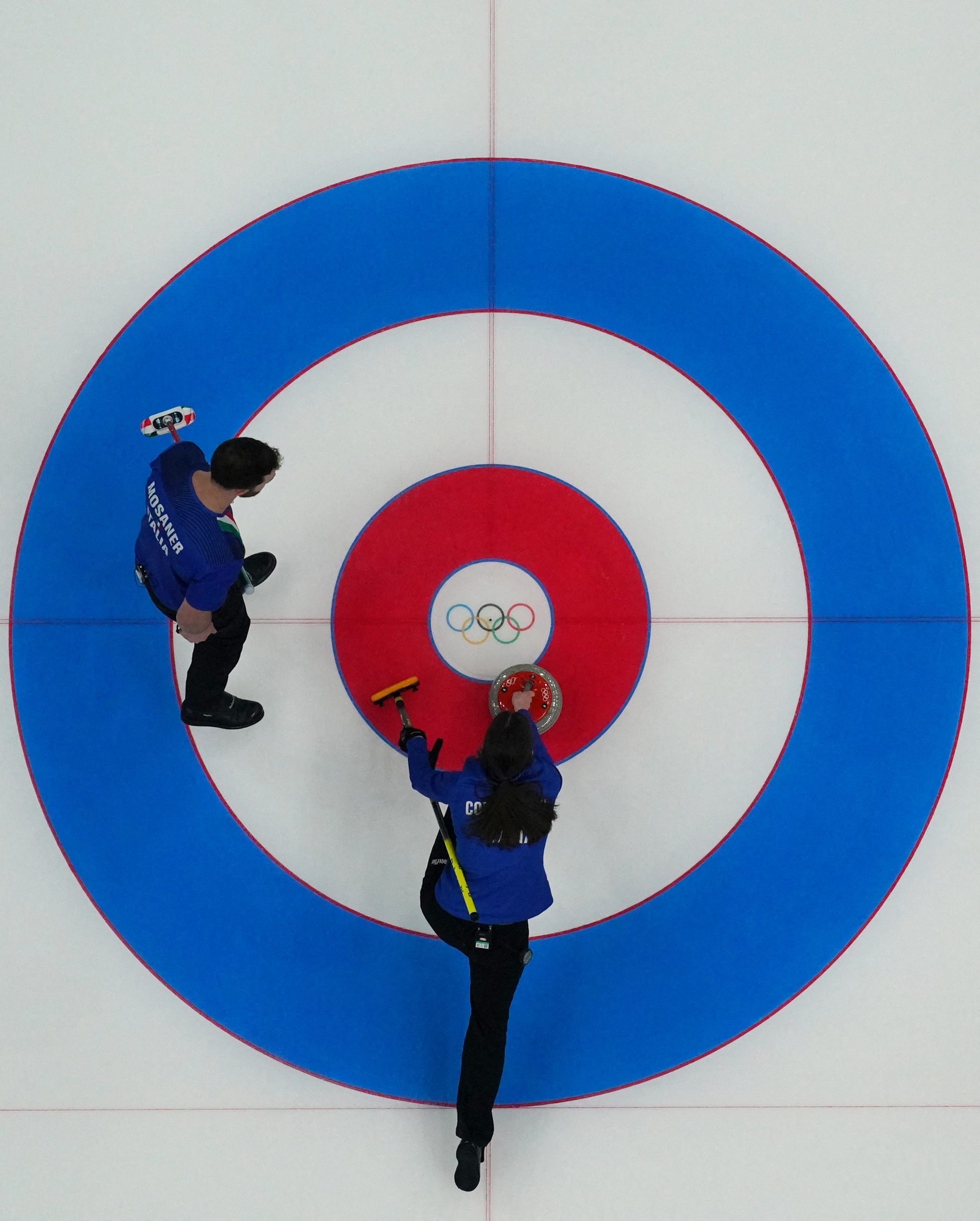 2022 Beijing Olympics - Curling - Mixed Doubles Gold Medal Game - Italy v Norway - National Aquatics Center, Beijing, China - February 8, 2022. Stefania Constantini of Italy and Amos Mosaner of Italy in action. REUTERS