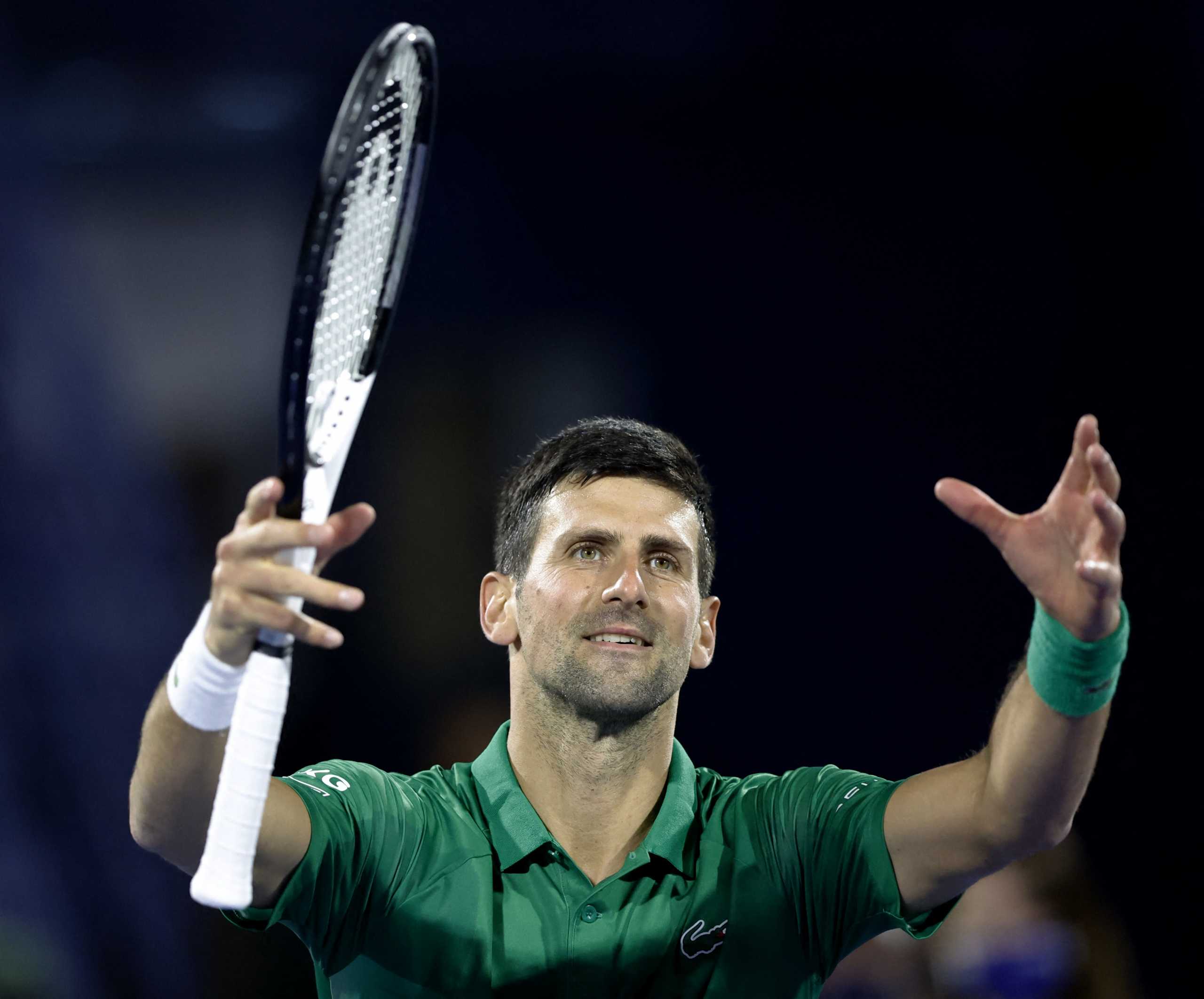 Tennis - ATP 500 - Dubai Tennis Championships - Aviation Club Tennis Centre, Dubai, United Arab Emirates - February 21, 2022 Serbia's Novak Djokovic celebrates winning his first round match against Italy's Lorenzo Musetti REUTERS