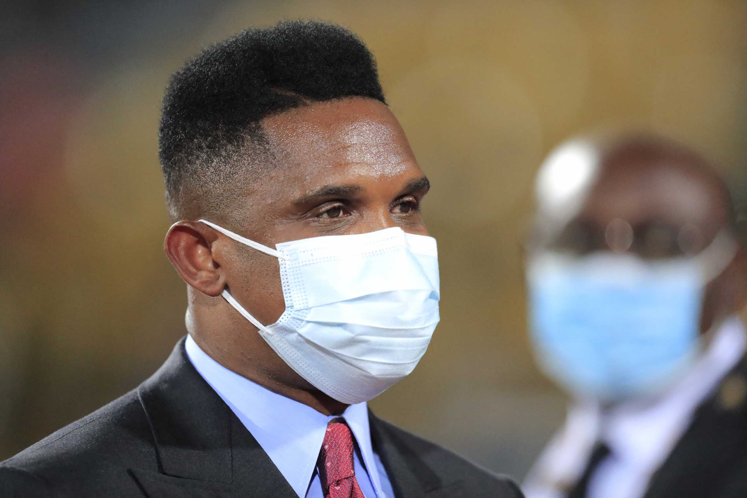 Soccer Football - Africa Cup of Nations - Third Place Playoff Match - Burkina Faso v Cameroon - Ahmadou Ahidjo Stadium, Yaounde, Cameroon - February 5, 2022  Former Cameroon player Samuel Eto'o is seen wearing a protective face mask after they won the third place playoff REUTERS