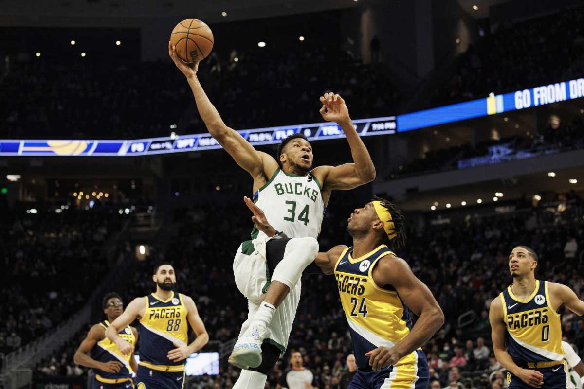 Feb 15, 2022; Milwaukee, Wisconsin, USA;  Milwaukee Bucks forward Giannis Antetokounmpo (34) drives for a dunk during the first quarter against the Indiana Pacers at Fiserv Forum. Mandatory Credit: Jeff Hanisch-USA TODAY Sports